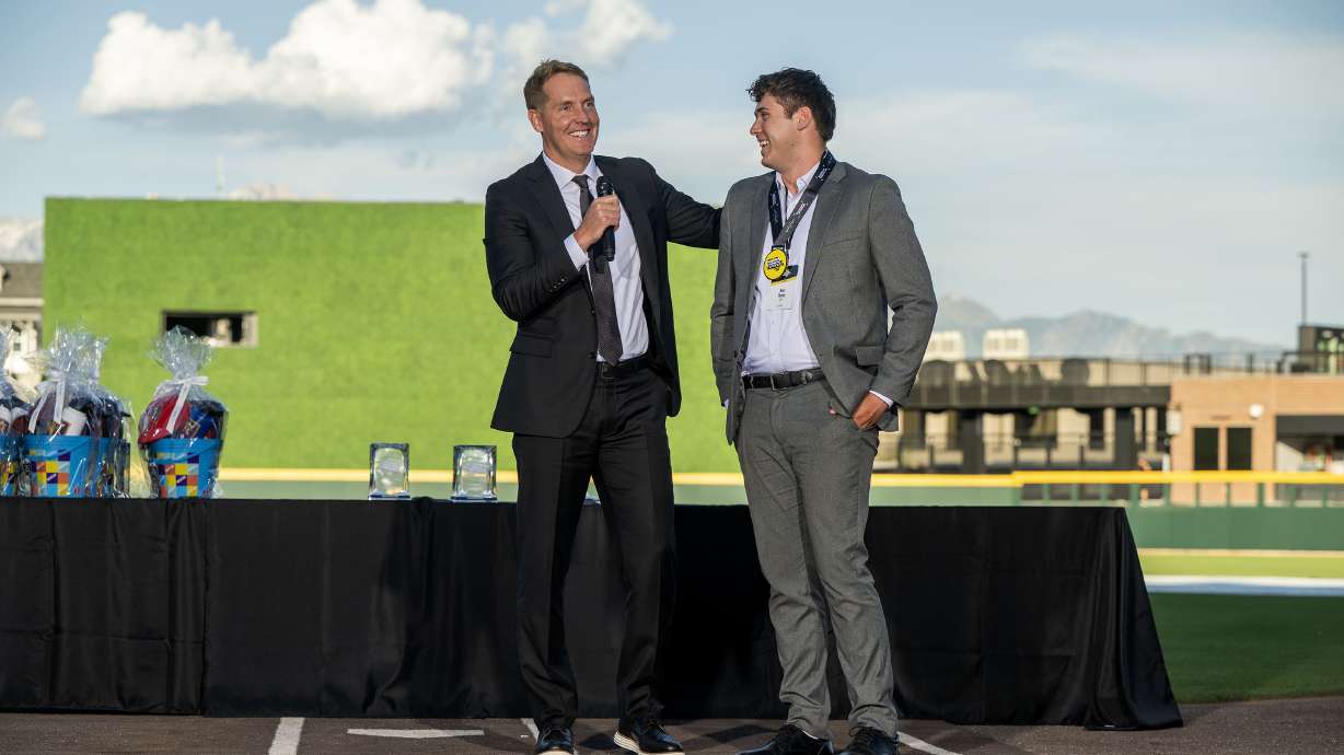 Former BYU, NBA and Europian basketball player Travis Hansen talks with Ben Hone, who battles Type 1 diabetes. Hansen donated $5,000 toward Hone’s missionary service while at the Deseret News high school sports awards at The Ballpark at America First Square, in South Jordan on Monday, June 9, 2025.