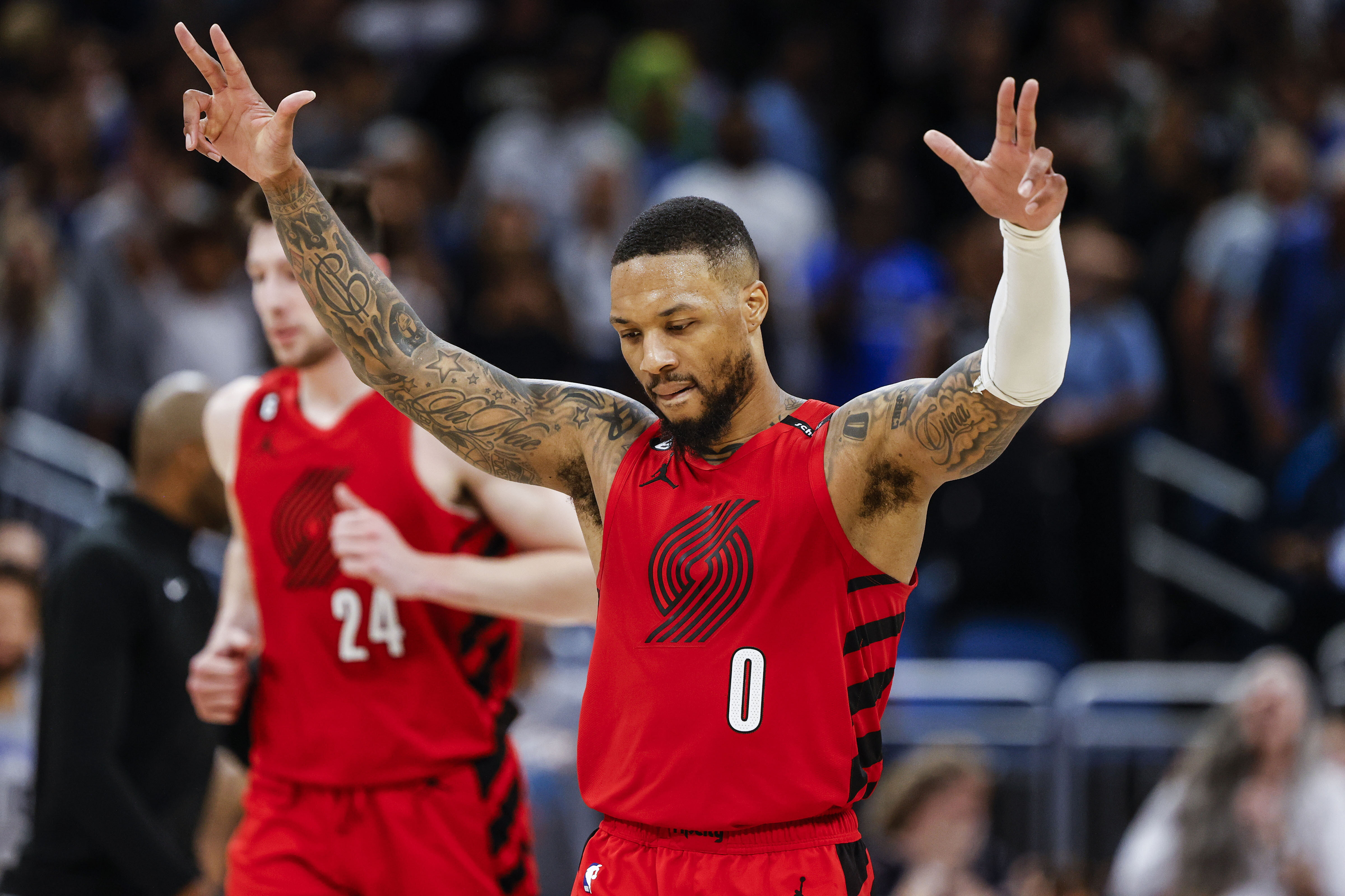 FILE - Portland Trail Blazers guard Damian Lillard (0) celebrates after a shot against the Orlando Magic during the second half of an NBA basketball game, March 5, 2023, in Orlando, Fla.