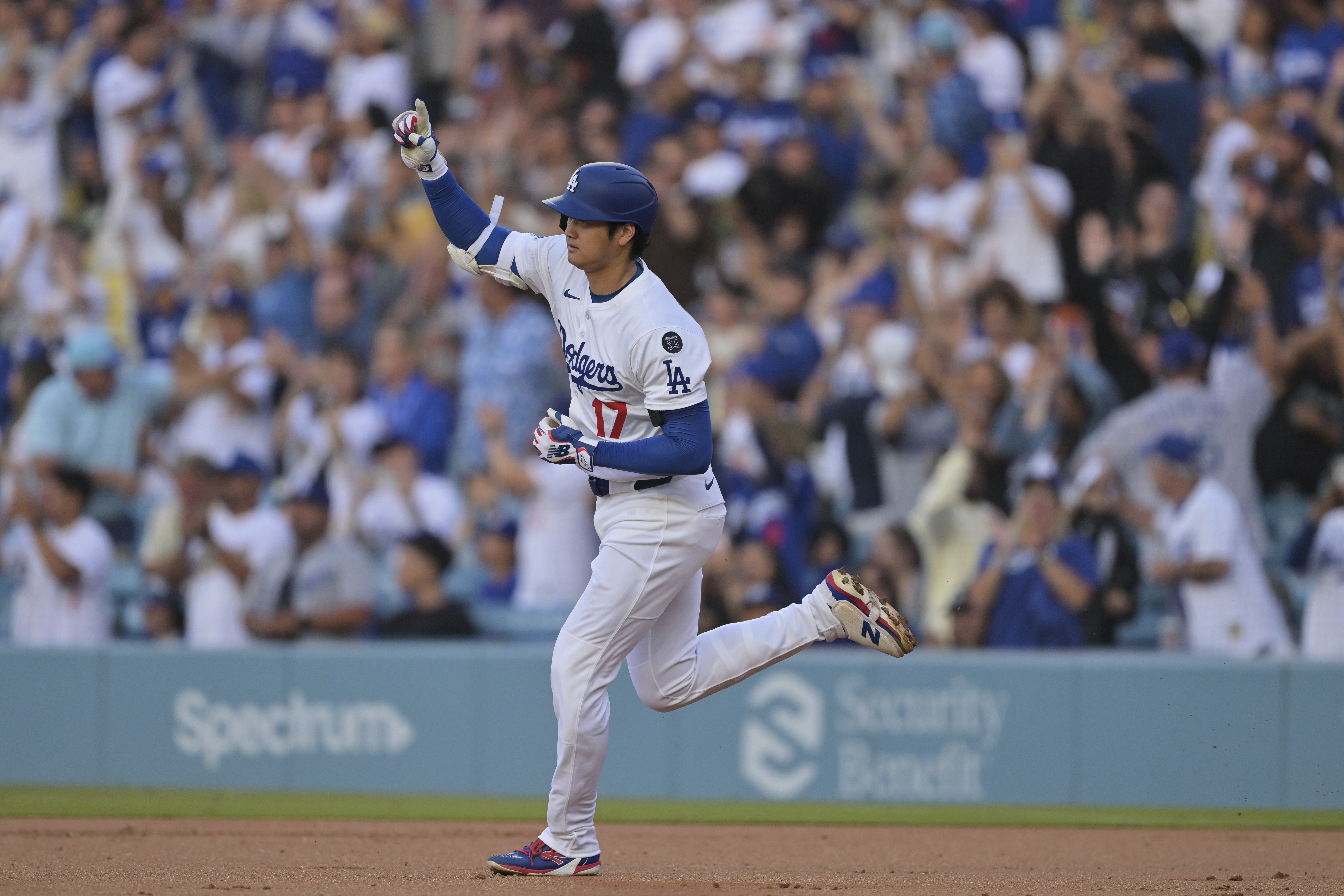 Los Angeles Dodgers pitcher Shohei Ohtani gestures after hitting a two-run home run during the first inning of a baseball game against the Minnesota Twins in Los Angeles, Monday, July 21, 2025. 