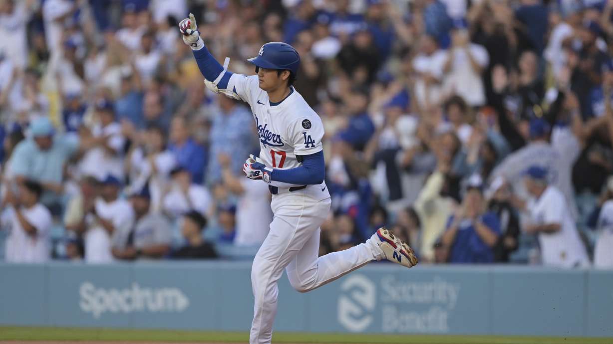 Los Angeles Dodgers pitcher Shohei Ohtani gestures after hitting a two-run home run during the first inning of a baseball game against the Minnesota Twins in Los Angeles, Monday, July 21, 2025.