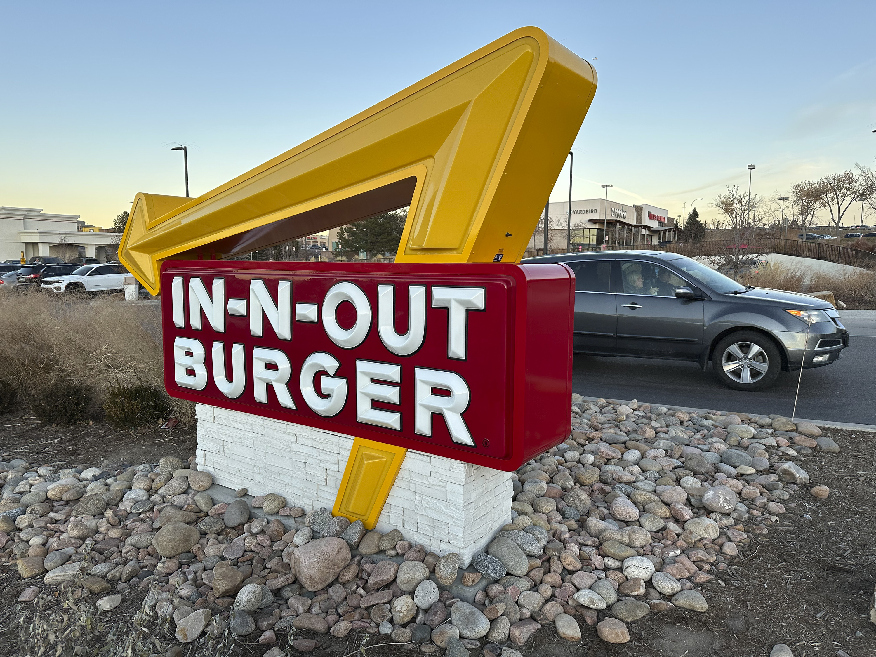 The sign outside an In-N-Out Burger restaurant Dec. 8, 2024, in Lone Tree, Colo. In-N-Out owners say their decision to relocate company headquarters is thanks to the lack of business and family-friendly policies in California.