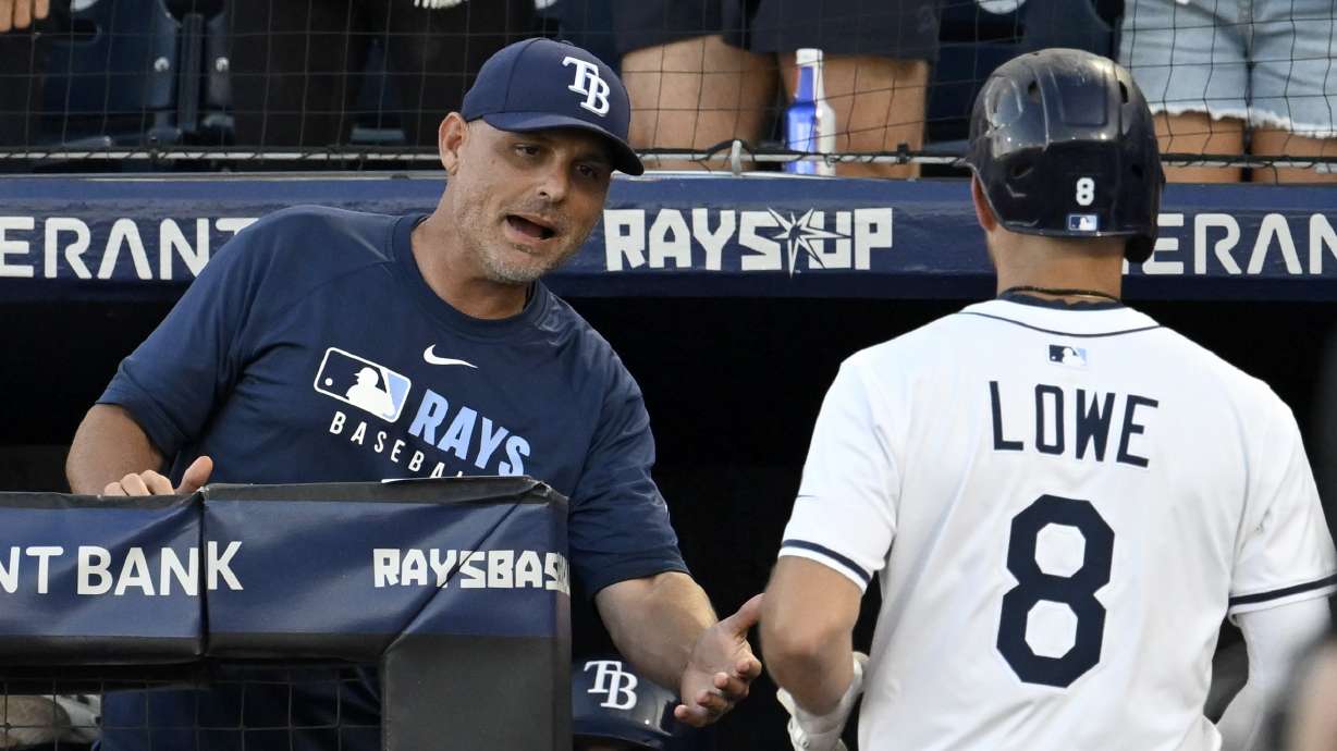 Tampa Bay Rays manger Kevin Cash congratulates Tampa Brandon Lowe after Lowe's home run during the third inning of a baseball game against the Athletics Tuesday, July 1, 2025, in Tampa, Fla.