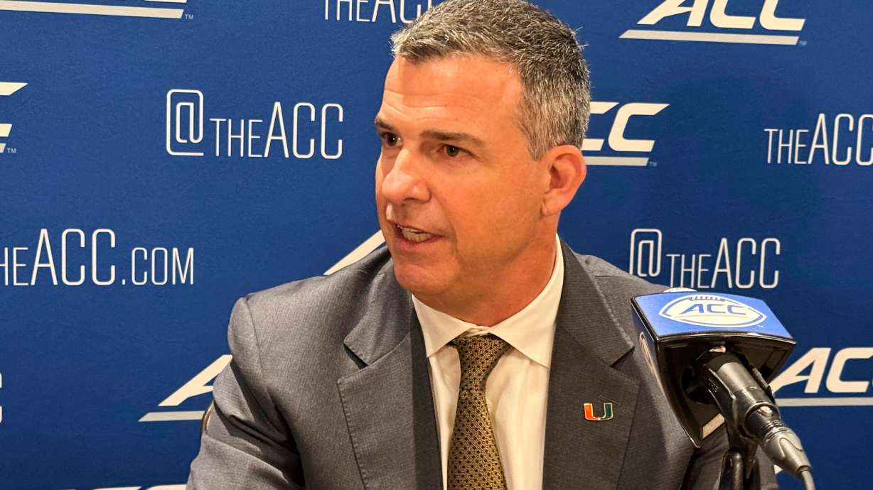 Miami coach Mario Cristobal speaks at the Atlantic Coast Conference NCAA college football media days, Tuesday, July 22, 2025, in Charlotte, N.C.