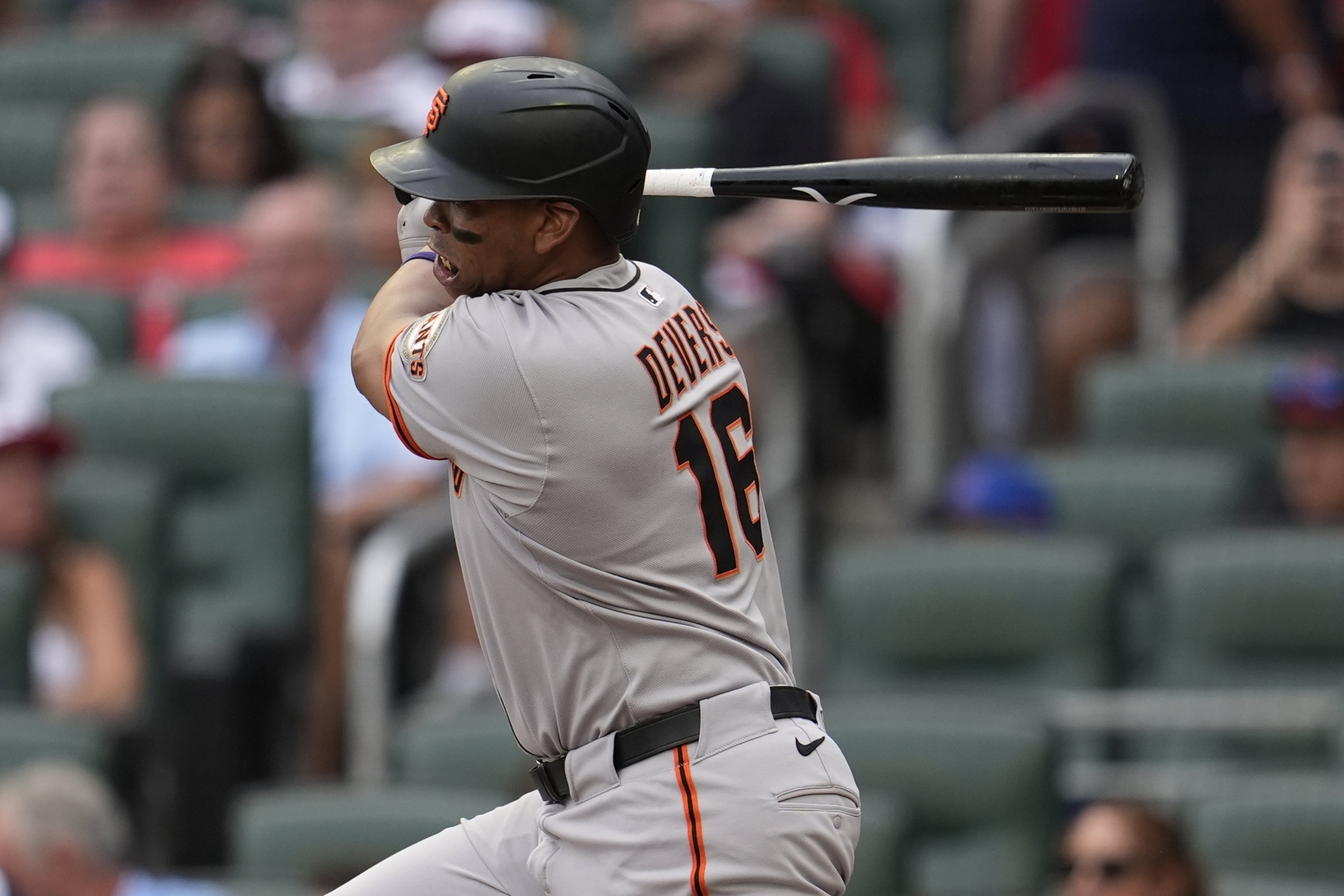 San Francisco Giants designated hitter Rafael Devers (16) hits a single against the Atlanta Braves in the first inning of a baseball game, Monday, July 21, 2025, in Atlanta. 