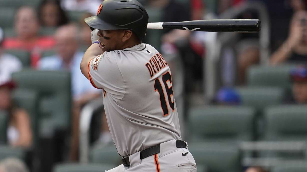 San Francisco Giants designated hitter Rafael Devers (16) hits a single against the Atlanta Braves in the first inning of a baseball game, Monday, July 21, 2025, in Atlanta.