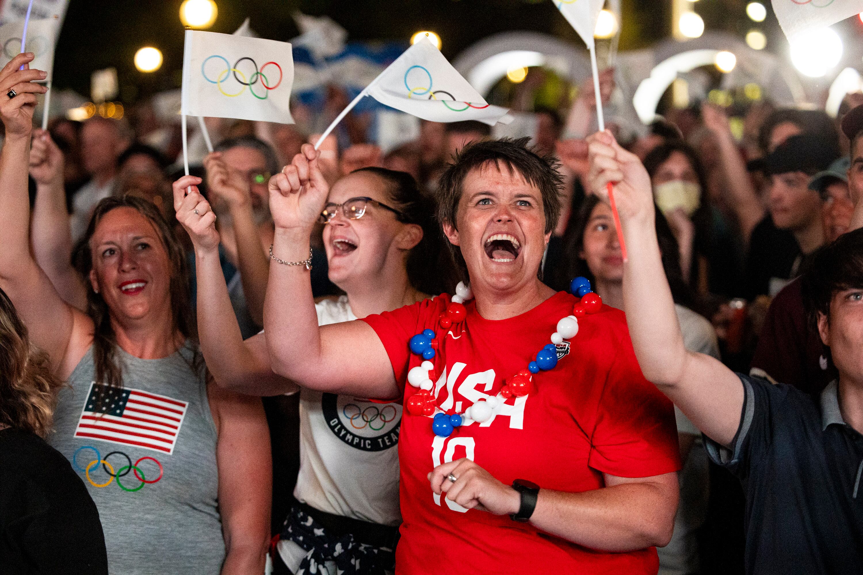 Izzy Gustafson, of South Jordan, cheers during a live watch party for the 2034 Winter Olympics bid at Washington Square Park on July 24, 2024, in downtown Salt Lake City. Thursday will mark one year since the Winter Olympics were awarded to Utah.