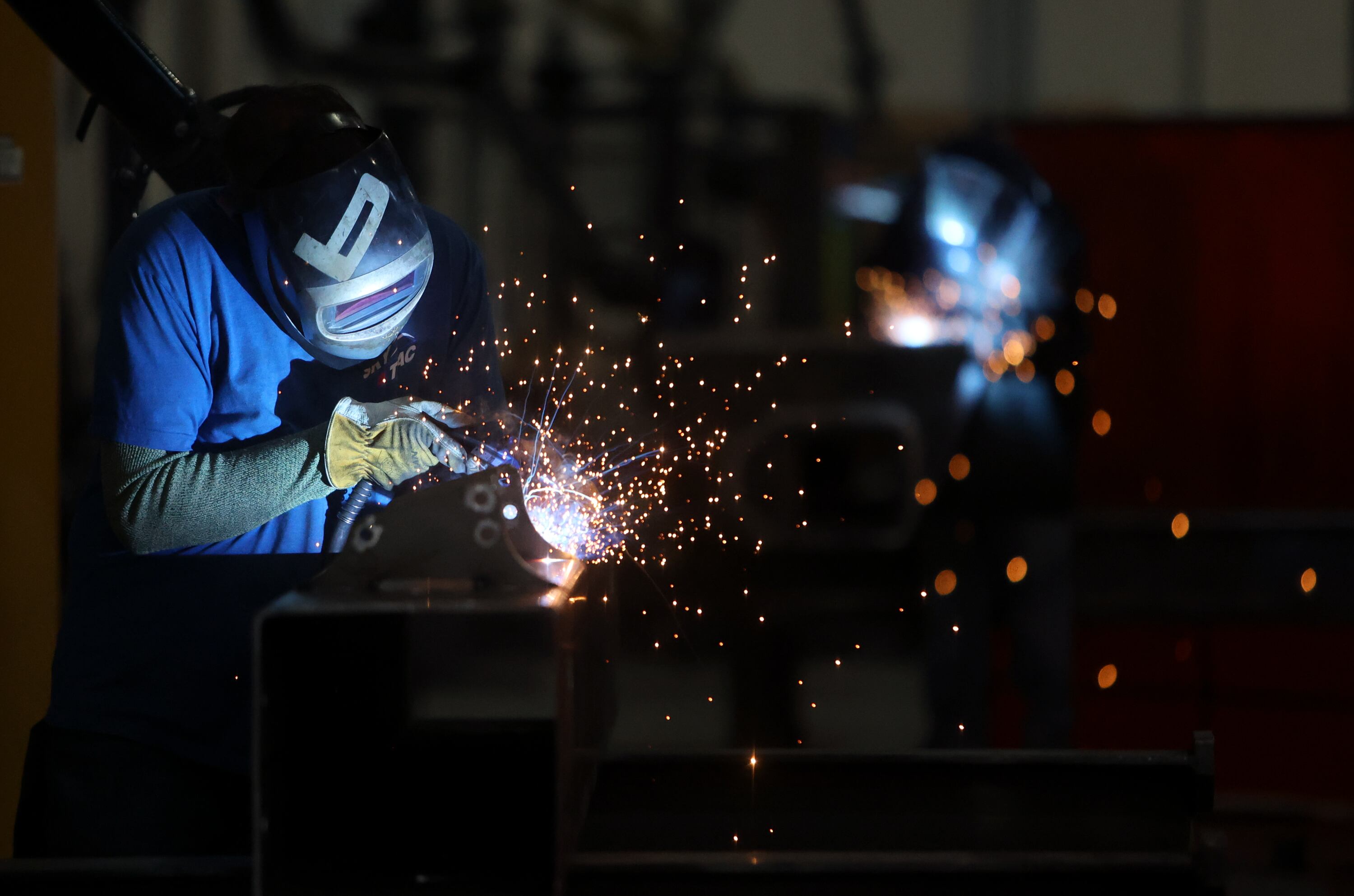 Joshua Skuppin welds a chairlift tower at the HTI Group facility in Tooele on Tuesday. FTC Commissioner Melissa Holyoak visited the facility to highlight the group's domestic production.