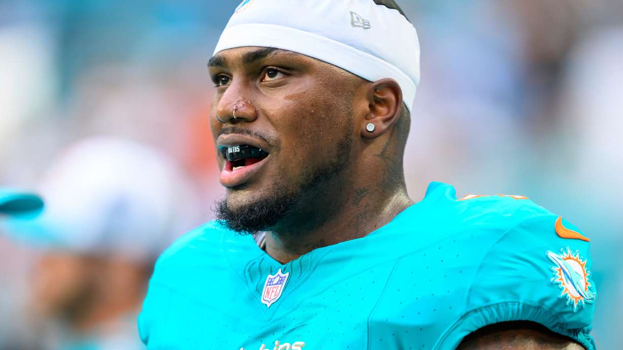 FILE - Miami Dolphins tackle Bayron Matos stands on the sidelines before the start of a preseason NFL football game against the Atlanta Falcons, Friday, Aug. 9, 2024, in Miami Gardens, Fla. (AP Photo/Doug Murray, File(