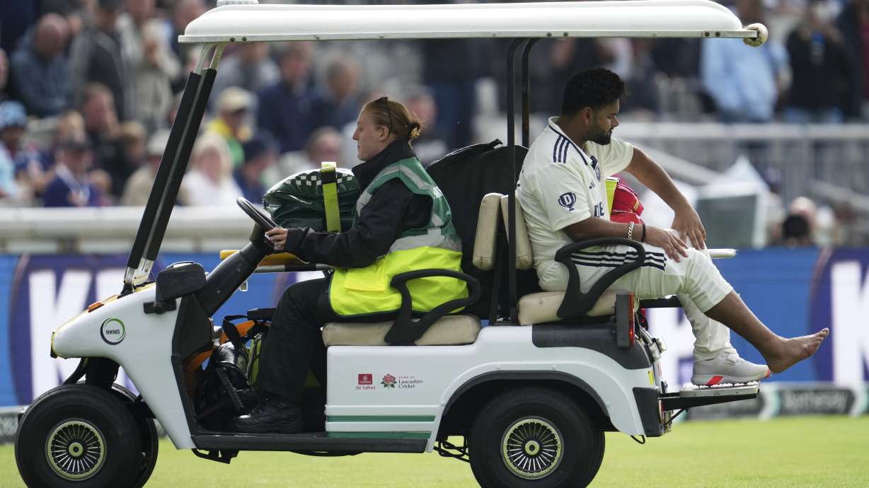 India's Rishabh Pant driven off the field after getting hurt during the fourth cricket test match between England and India at Emirates Old Trafford, Manchester, England, Wednesday, July 23, 2025.