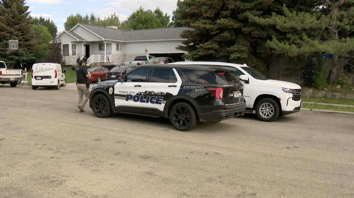 Police investigate a home on Monday in connection with a double stabbing that occurred the night before at a Heber City restaurant. Two more men were arrested Tuesday, bringing the total to five individuals under investigation for the stabbings.