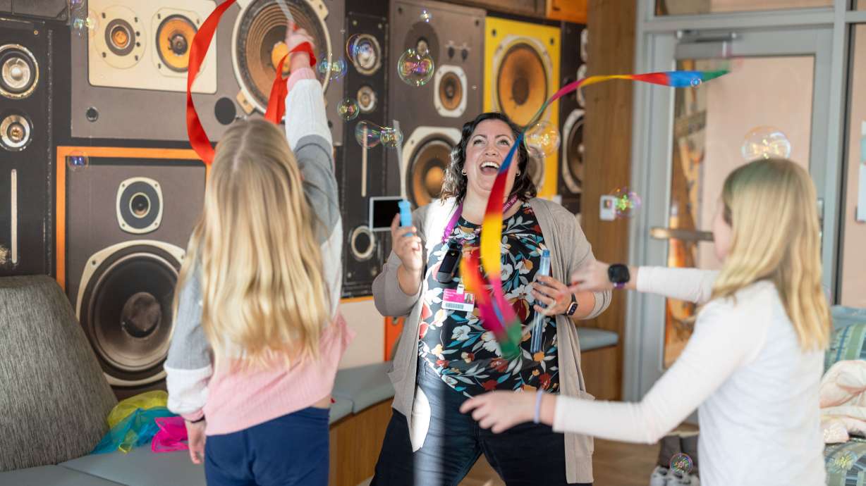 A music therapist and patients celebrate the opening of Sophie's Place, a new music therapy room at Primary Children's Hospital, Miller Family Campus, in Lehi on Wednesday.