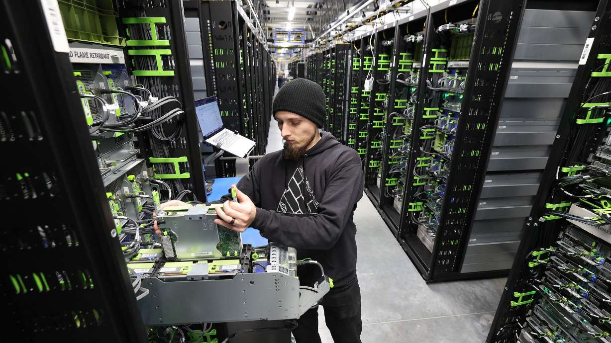 Dylan Poulsen works on a server at Meta’s Eagle Mountain Data Center in Eagle Mountain on Sept. 30, 2022. A report by Western Resource Advocates warns of the need to be prepared for energy and water that data centers demand.
