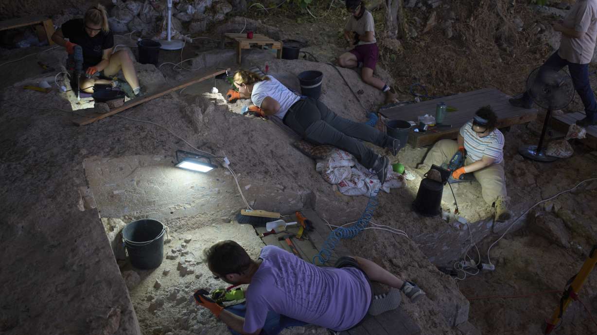 Volunteers work in Tinshemet Cave, where archaeologists are excavating one of the world's oldest known burial sites, dating back 100,000 years, near Shoam, Israel, July 15.