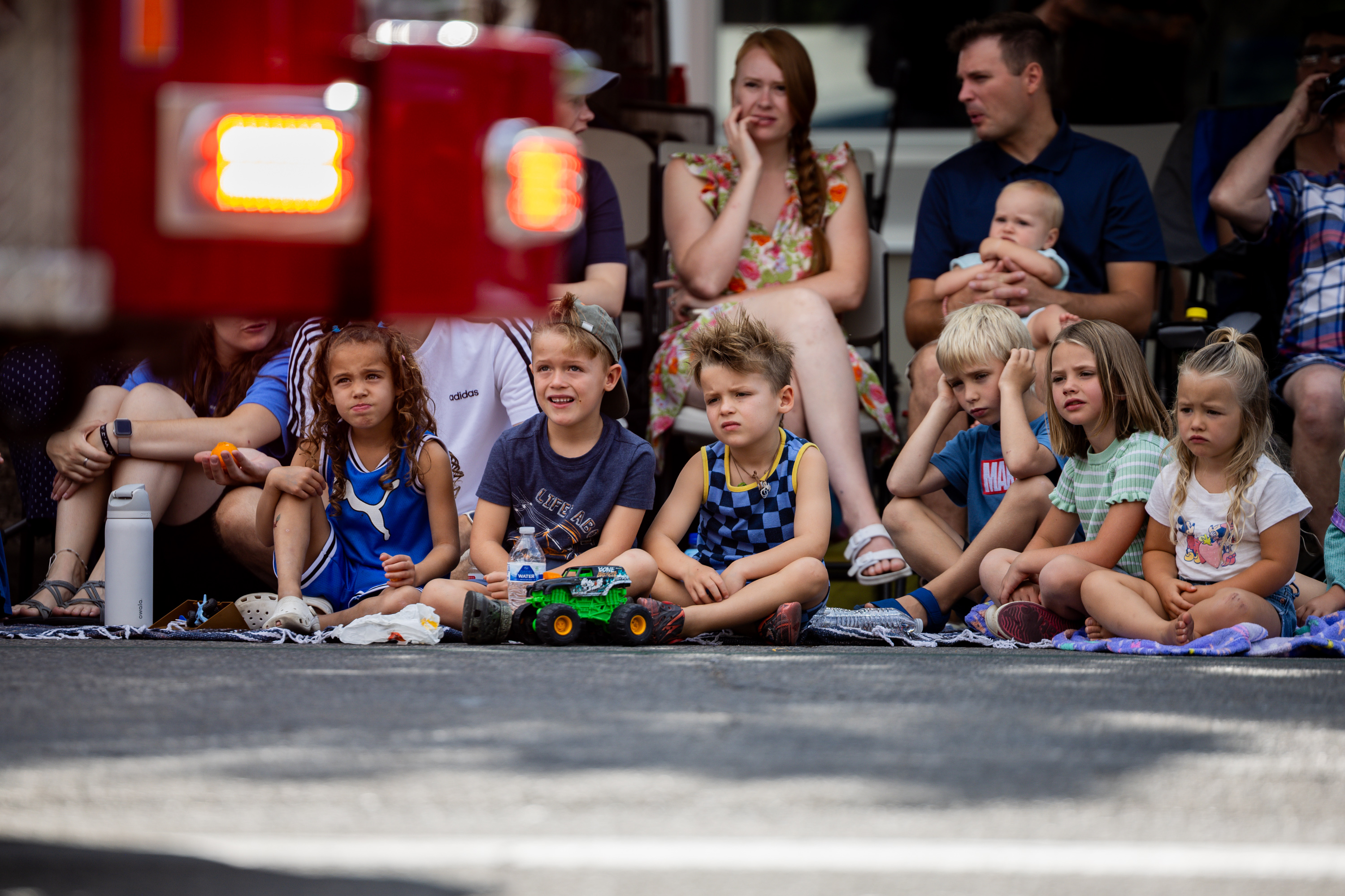 People watch as the Salt Lake City Fire Engine drives by in the Days of '47 Parade in Salt Lake City on Thursday.