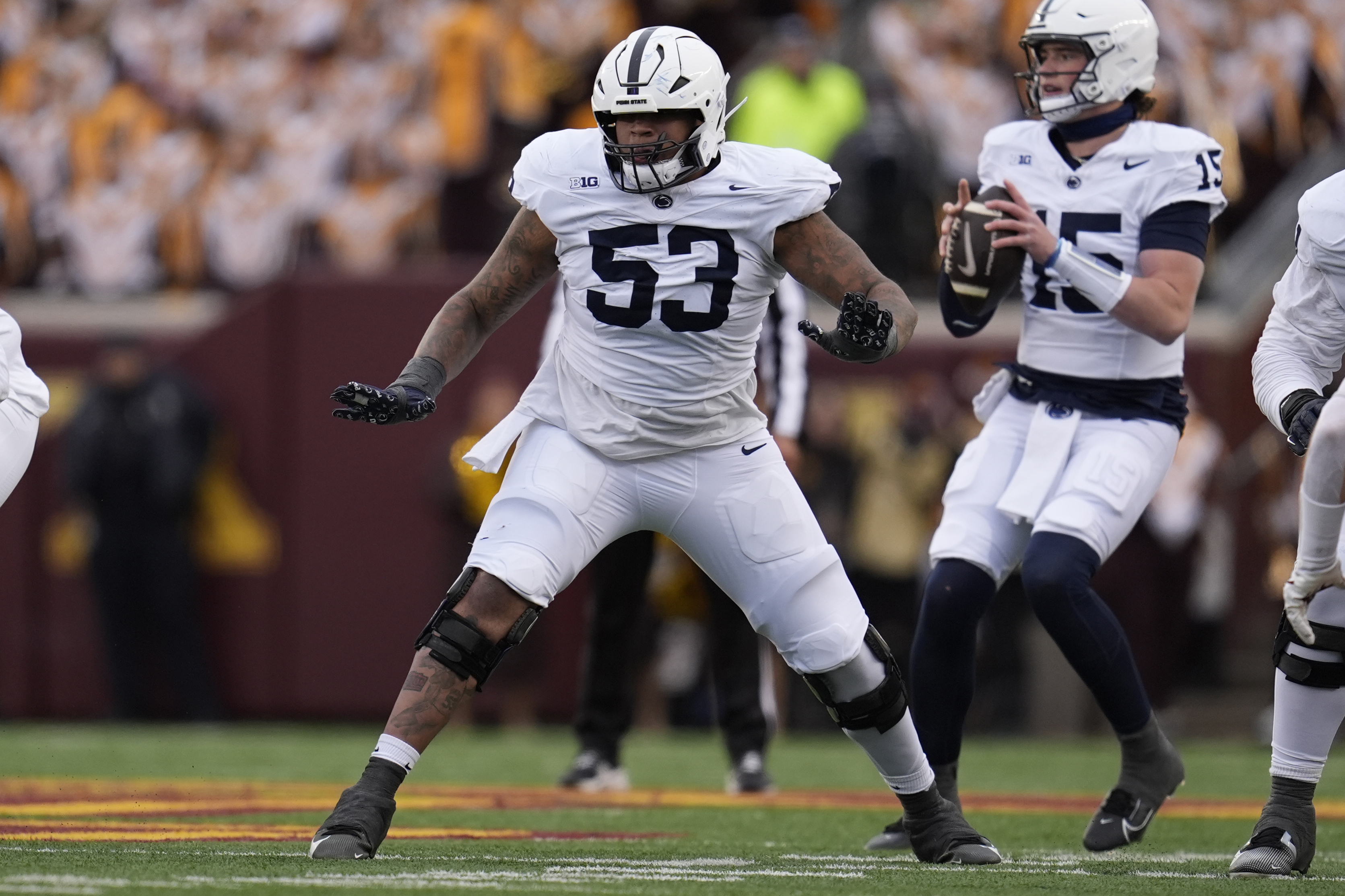 FILE - Penn State offensive lineman Nick Dawkins (53) in action during the first half of an NCAA college football game against Minnesota, Nov. 23, 2024, in Minneapolis.