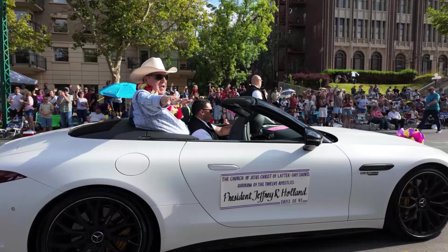 President Jeffrey Holland, acting president of the Quorum of the Twelve Apostles of The Church of Jesus Christ of Latter-day Saints, rides in the motorcade during the Days of ’47 Parade on Thursday. President Holland served as the parade's grand marshal.