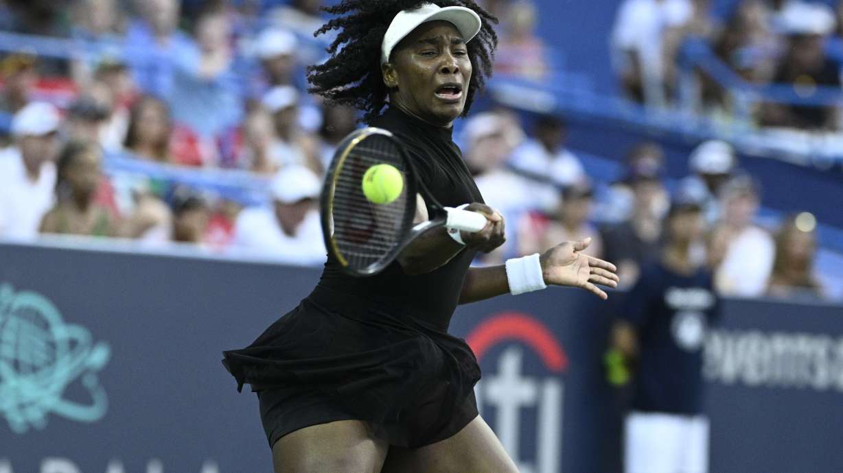 Venus Williams returns the ball against Magdalena Frech, of Poland, during a match at the Citi Open tennis tournament Thursday, July 24, 2025, in Washington.