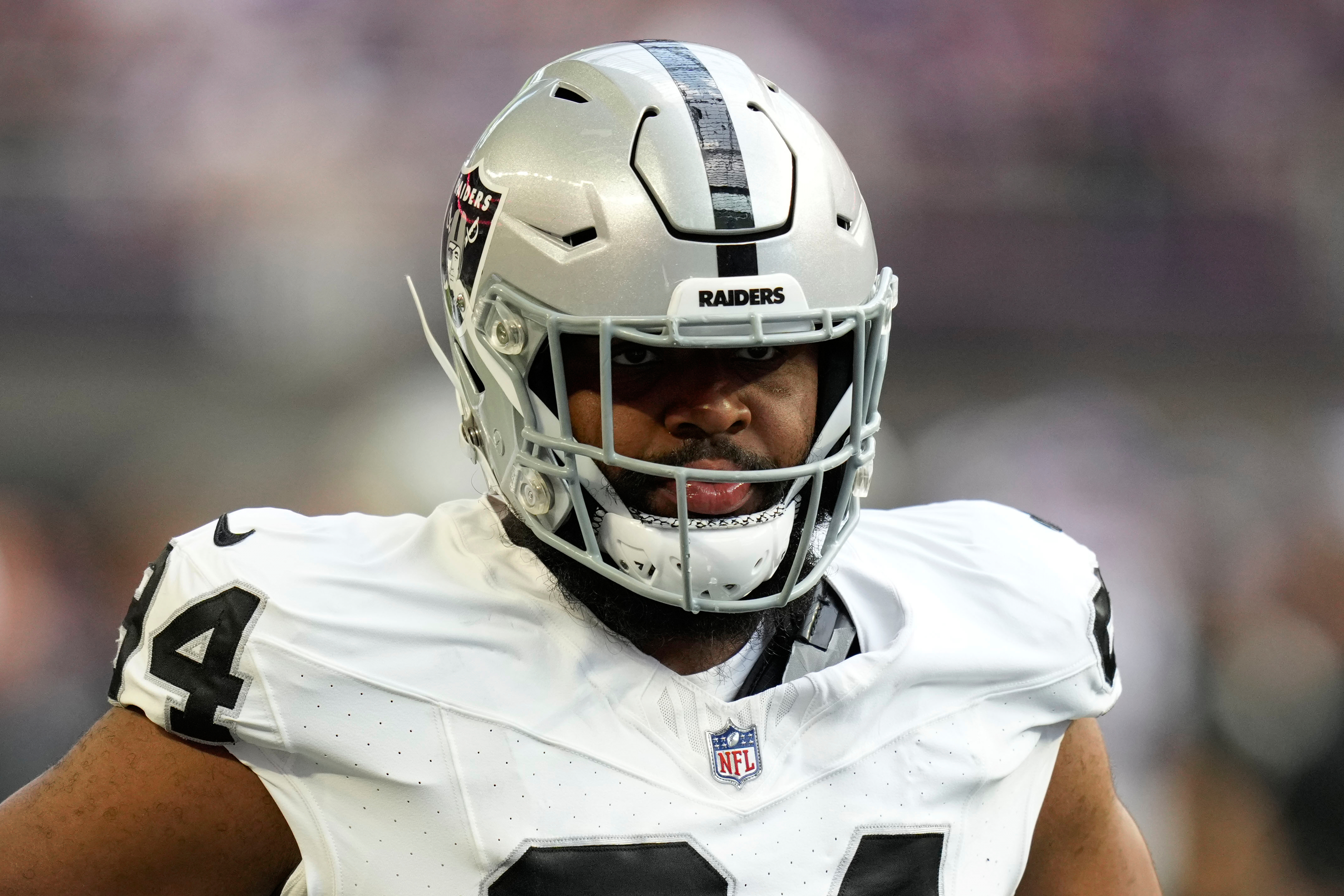 FILE - Las Vegas Raiders defensive tackle Christian Wilkins (94) warms up before an NFL preseason football game against the Minnesota Vikings, Saturday, Aug. 10, 2024, in Minneapolis. 