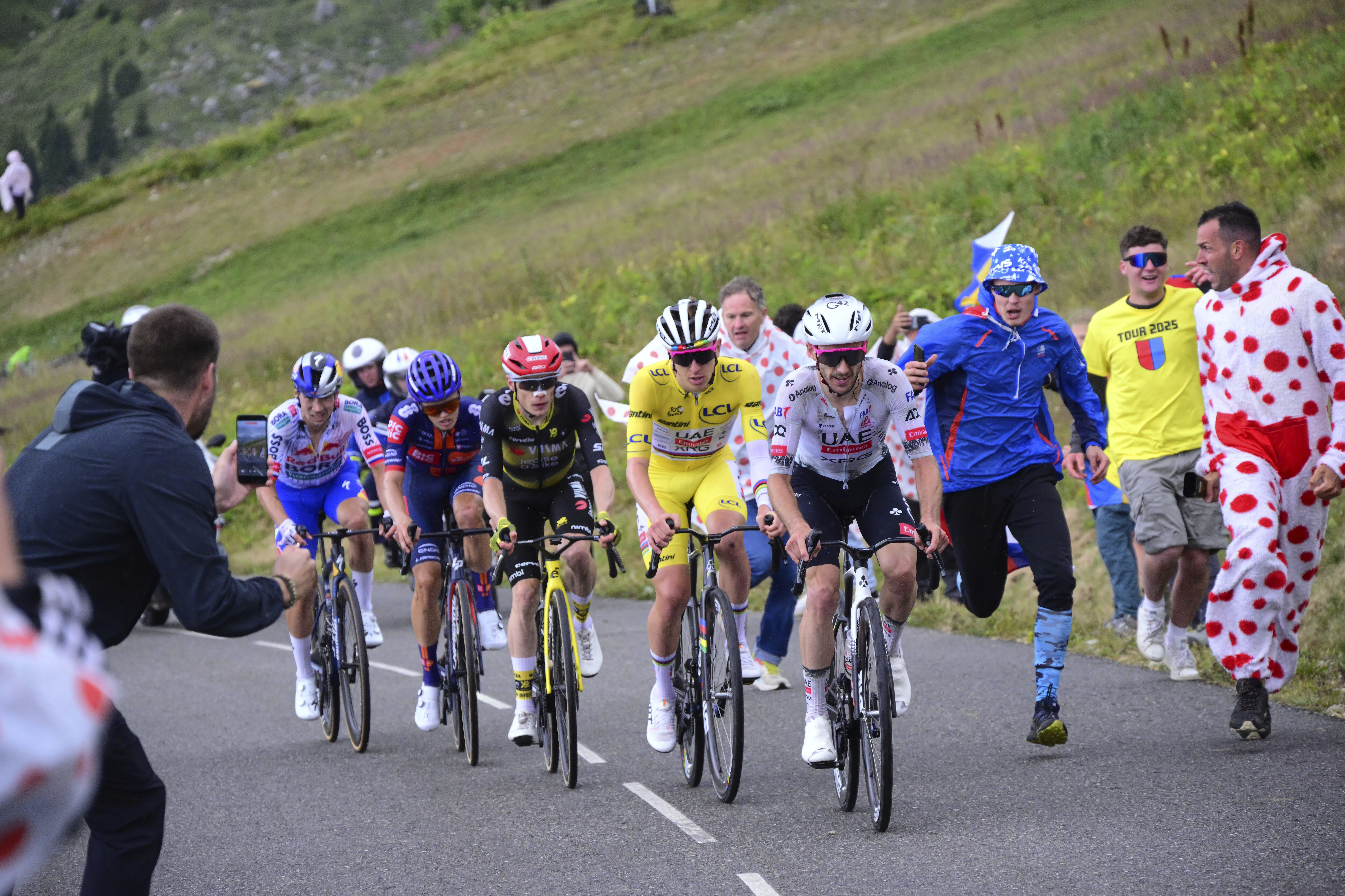 Britain's Adam Yates, Slovenia's Tadej Pogacar, wearing the overall leader's yellow jersey, Denmark's Jonas Vingegaard, Britain's Oscar Onley, and Slovenia's Primoz Roglic, climb during the eighteenth stage of the Tour de France cycling race over 171.5 kilometers (106.6 miles) with start in Vif and finish in Courchevel Col de la Loze, France, Thursday, July 24, 2025. 