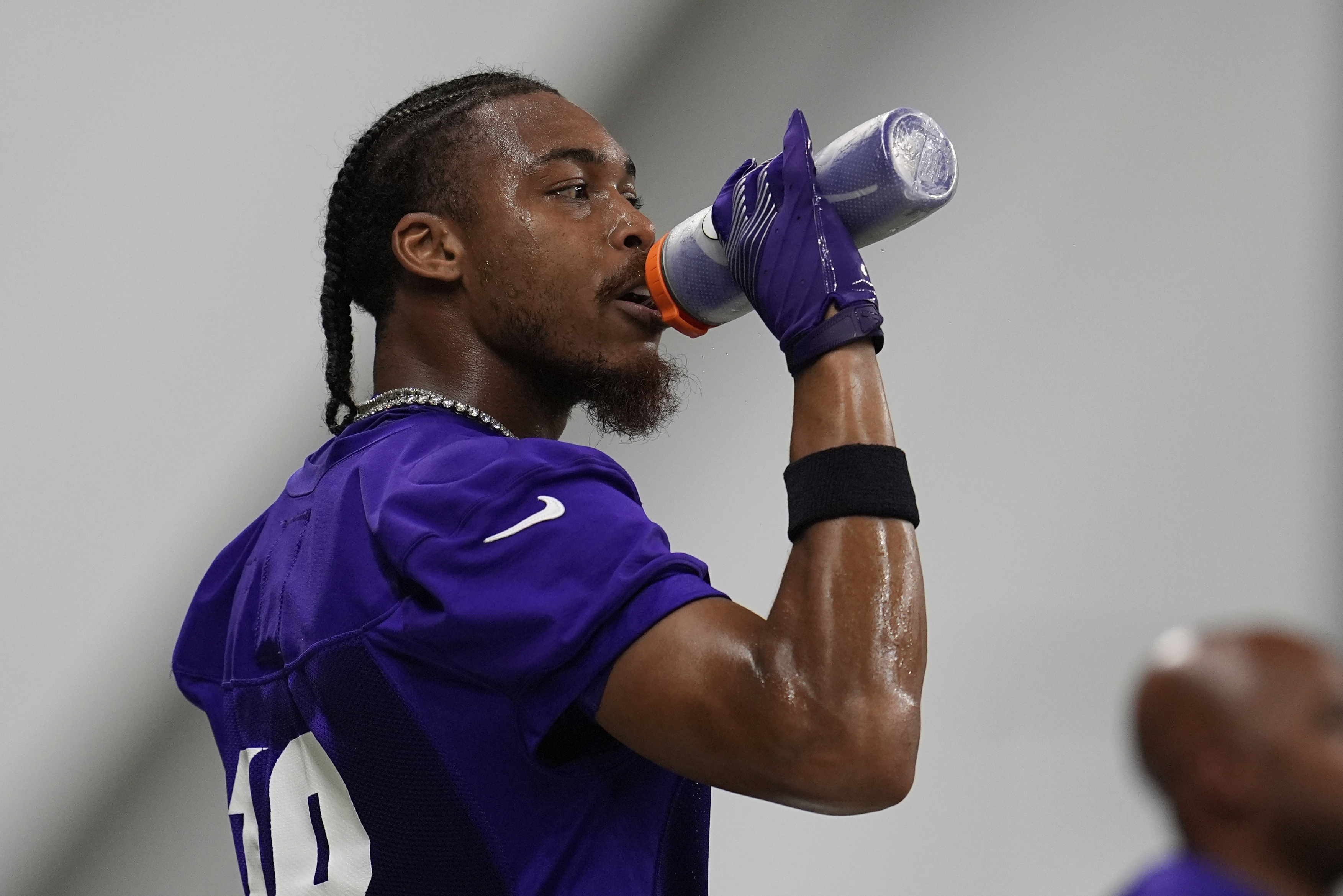 Minnesota Vikings wide receiver Justin Jefferson (18) hydrates during the team's NFL football training camp Wednesday, July 23, 2025, in Eagan, Minn. 