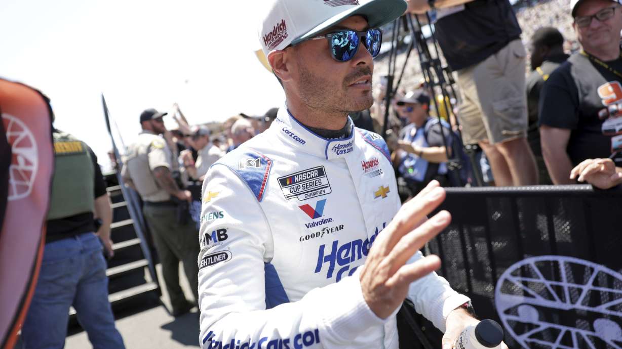 Kyle Larson waves at fans after being introduced before a NASCAR Cup Series auto race at Sonoma Raceway in Sonoma, Calif., Sunday, July 13, 2025.