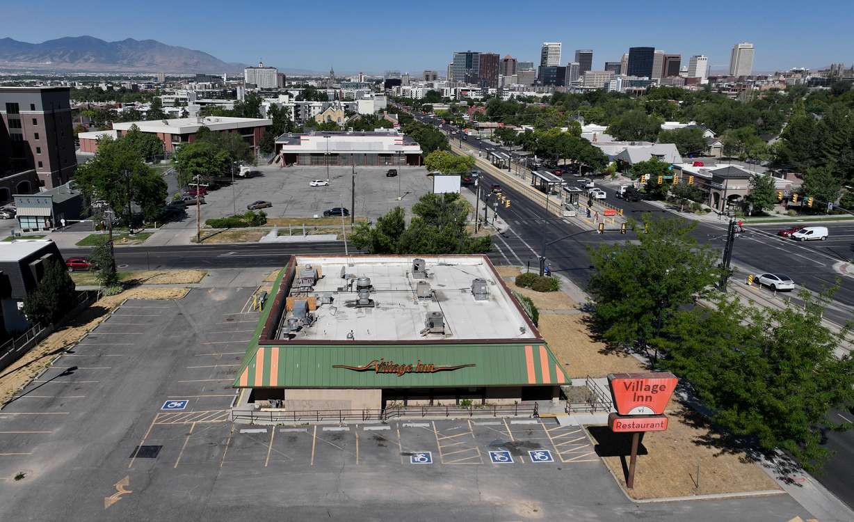 The shuttered Village Inn and OfficeMax locations in Salt Lake City are pictured on July 25. The sites are now set to be replaced by a new townhome complex and student housing over the next few years.