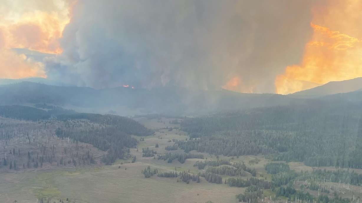 The Monroe Canyon Fire burning in Sevier County on July 25. The fire's containment dropped to 4% Saturday, and power crews are working to restore service in Bear Valley.