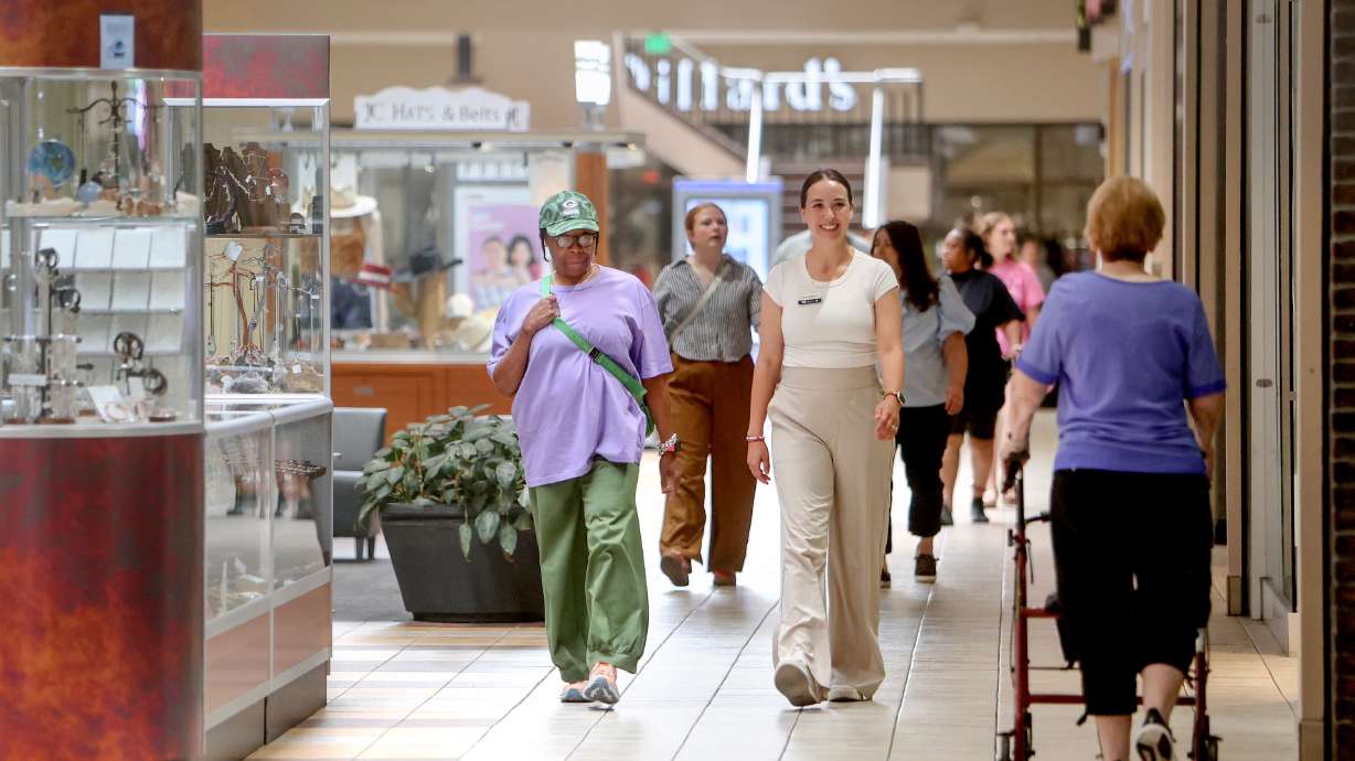 Paula Scott and Emma Parkhurst participate in the Walk the Hills Mall Walkers Club, put on by Layton Hills Mall and USU Extension, at Layton Hills Mall in Layton on July 17. Parkhurst leads the event.