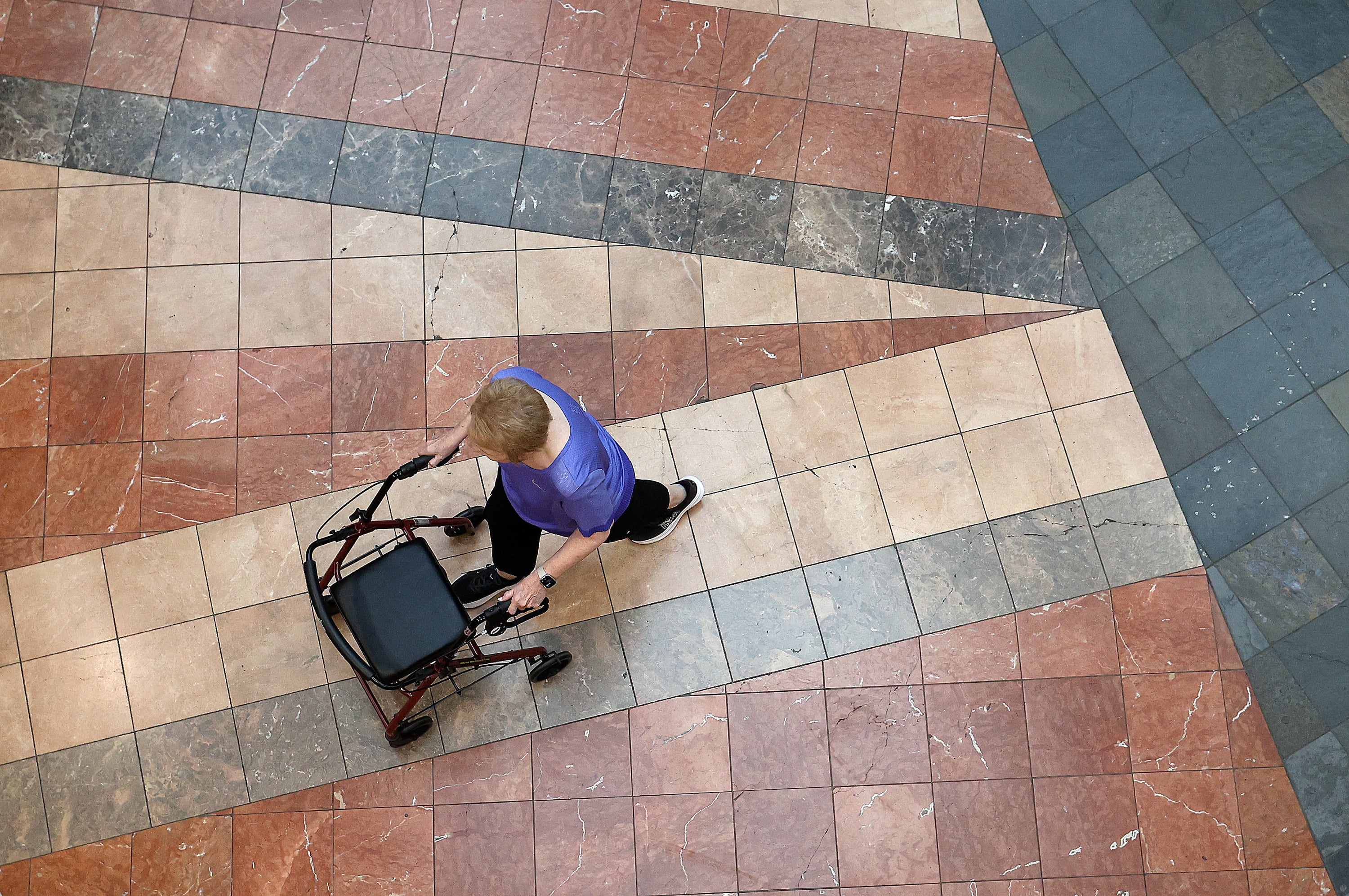 Judy Smith walks around Layton Hills Mall at the same time the Walk the Hills Mall Walkers Club is happening in Layton on July 17. Smith has been walking at the mall five times a week for years. The mall opens early to accommodate walkers.