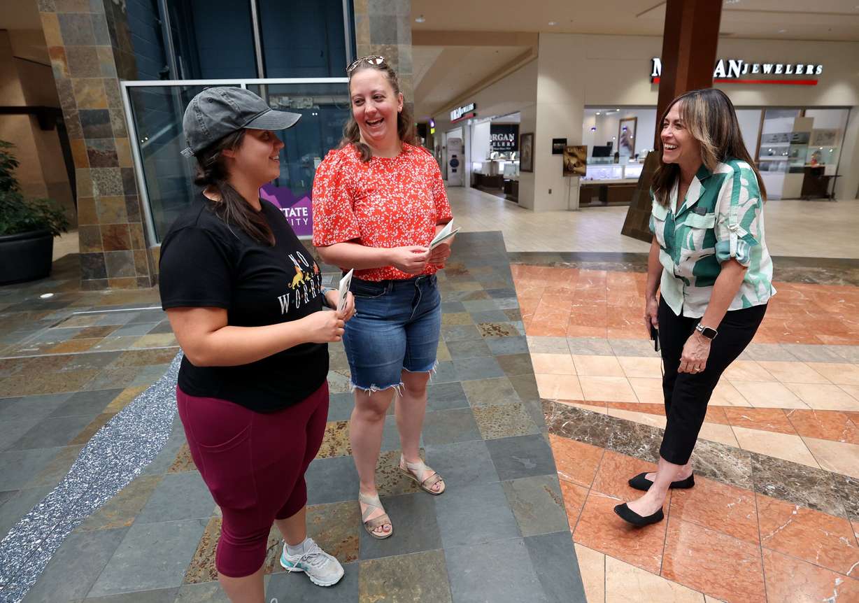 Courtney Call and Sharlie Robertson pause from walking to talk to Gladyris Larsen, Layton Hills Mall marketing manager, about the Walk the Hills Mall Walkers Club event at Layton Hills Mall in Layton on July 17. Call and Robertson came to the mall to walk but were unaware of the event.