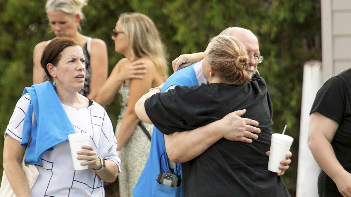Walmart employees and customers after a stabbing incident in Traverse City, Mich., Saturday. Six people were critically wounded in what Grand Traverse County Sheriff Michael Shea said appeared to be a random act.