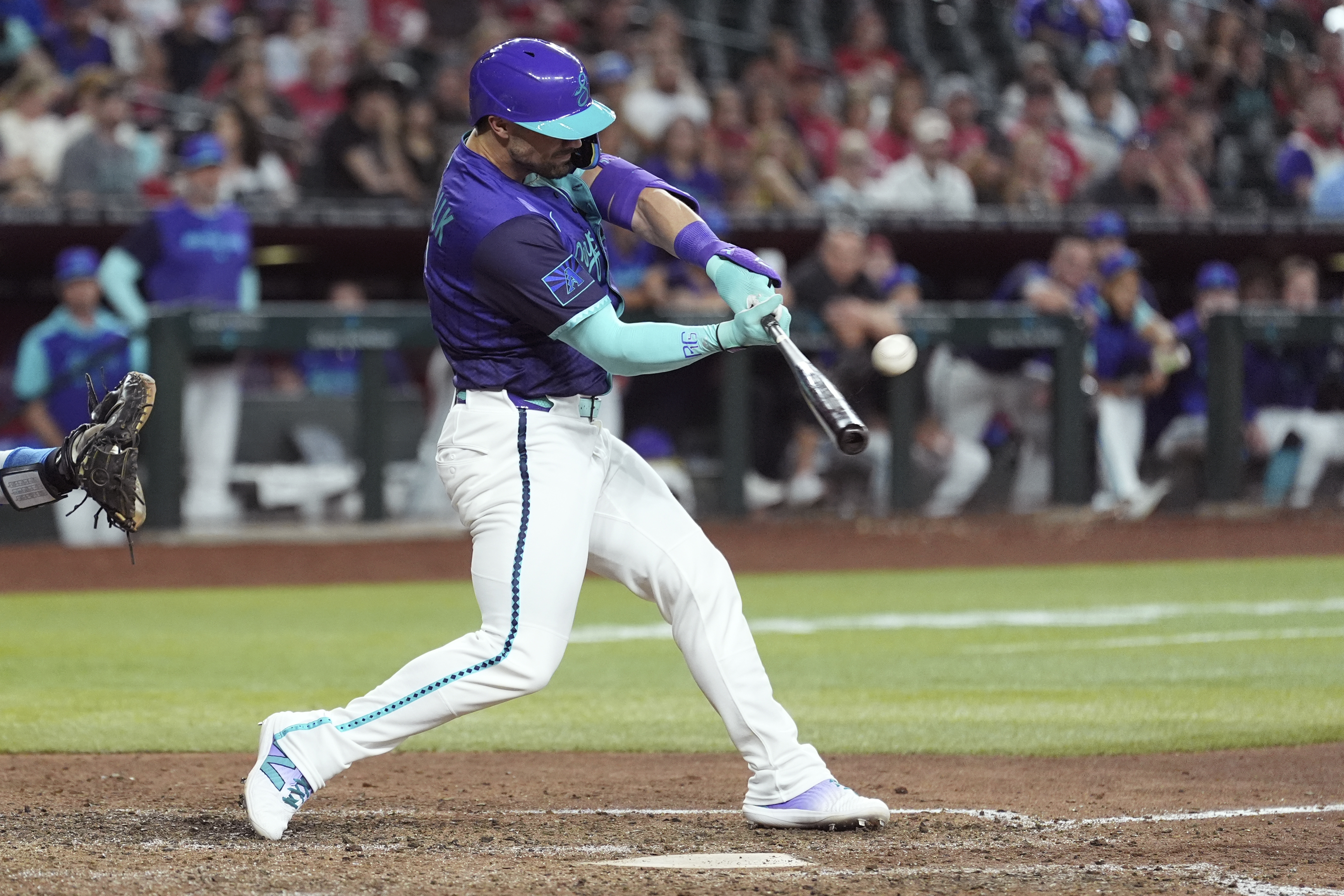 Arizona Diamondbacks' Randal Grichuk connects for an inside-the-park home run against the Kansas City Royals during the eighth inning of a baseball game Saturday, July 5, 2025, in Phoenix. 