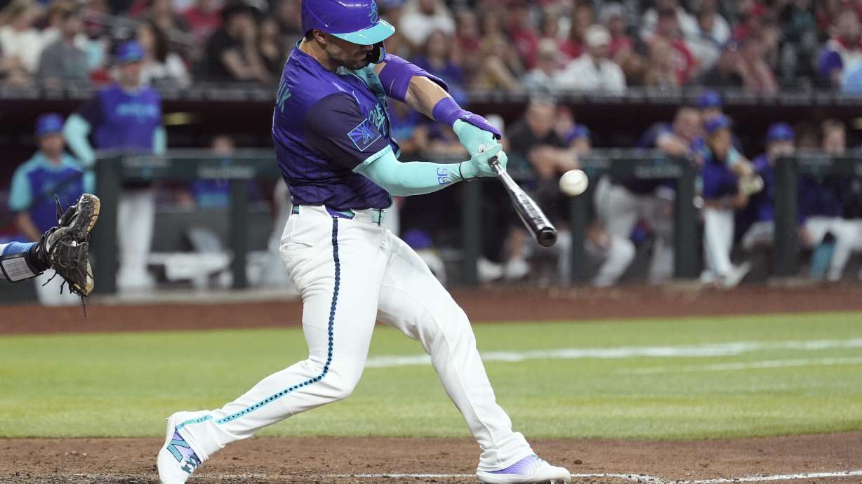 Arizona Diamondbacks' Randal Grichuk connects for an inside-the-park home run against the Kansas City Royals during the eighth inning of a baseball game Saturday, July 5, 2025, in Phoenix.
