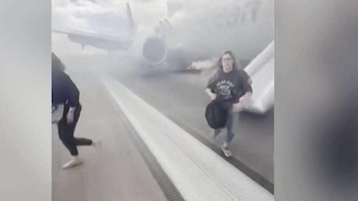 More than 150 passengers on an American Airlines flight departing from Denver International Airport Saturday were evacuated onto the runway after a "possible landing gear incident" left one person injured and sparked a fire, according to the FAA.