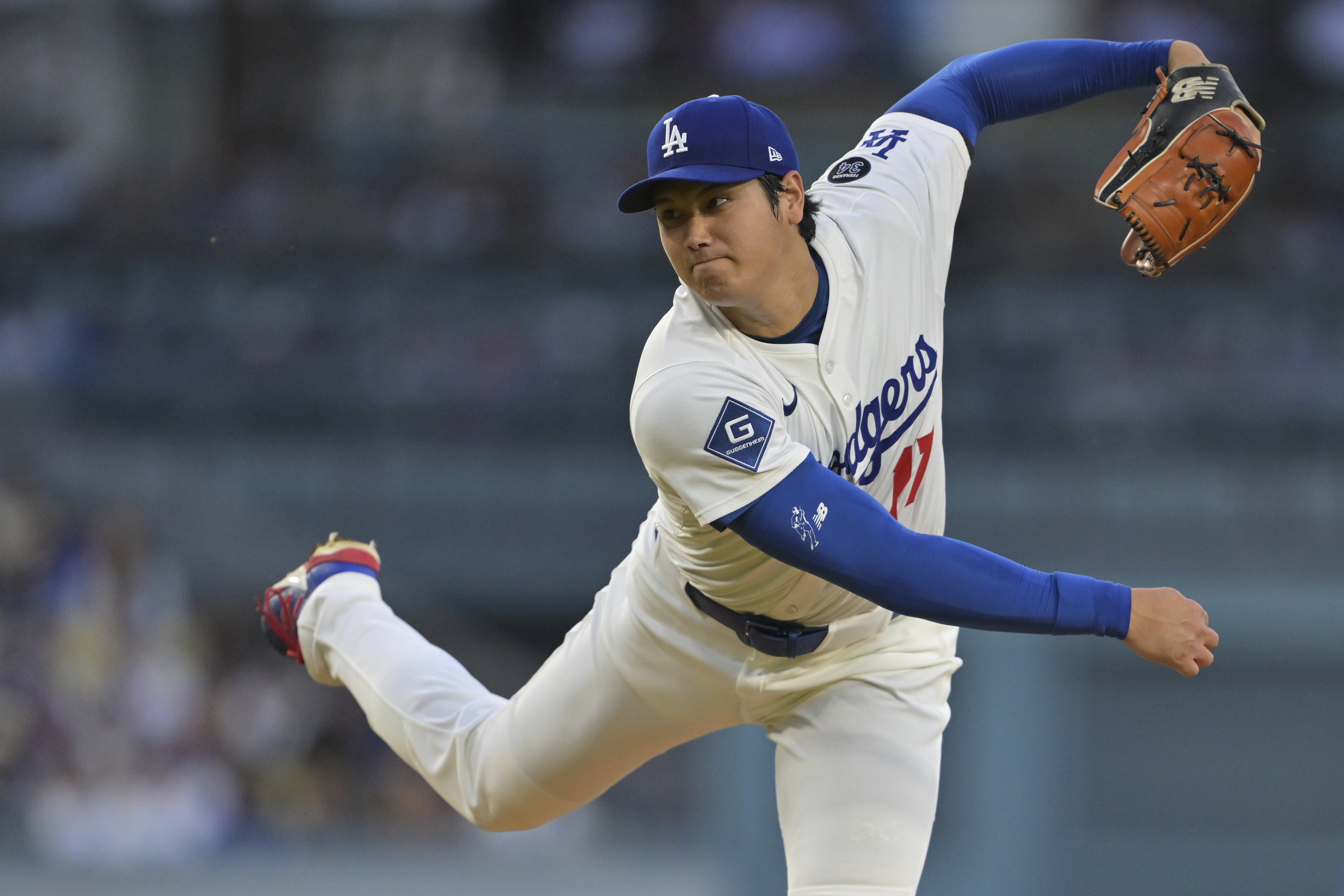 Los Angeles Dodgers pitcher Shohei Ohtani throws against the Minnesota Twins during the third inning of a baseball game in Los Angeles, Monday, July 21, 2025. 