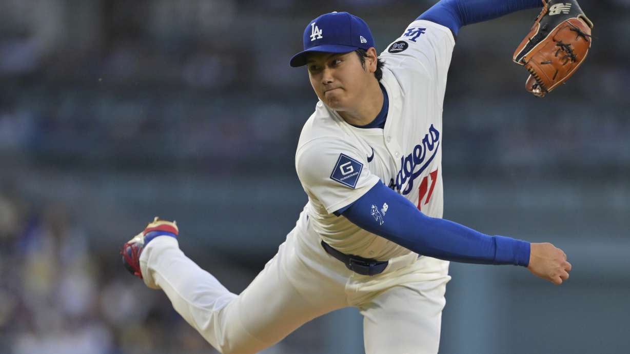 Los Angeles Dodgers pitcher Shohei Ohtani throws against the Minnesota Twins during the third inning of a baseball game in Los Angeles, Monday, July 21, 2025.