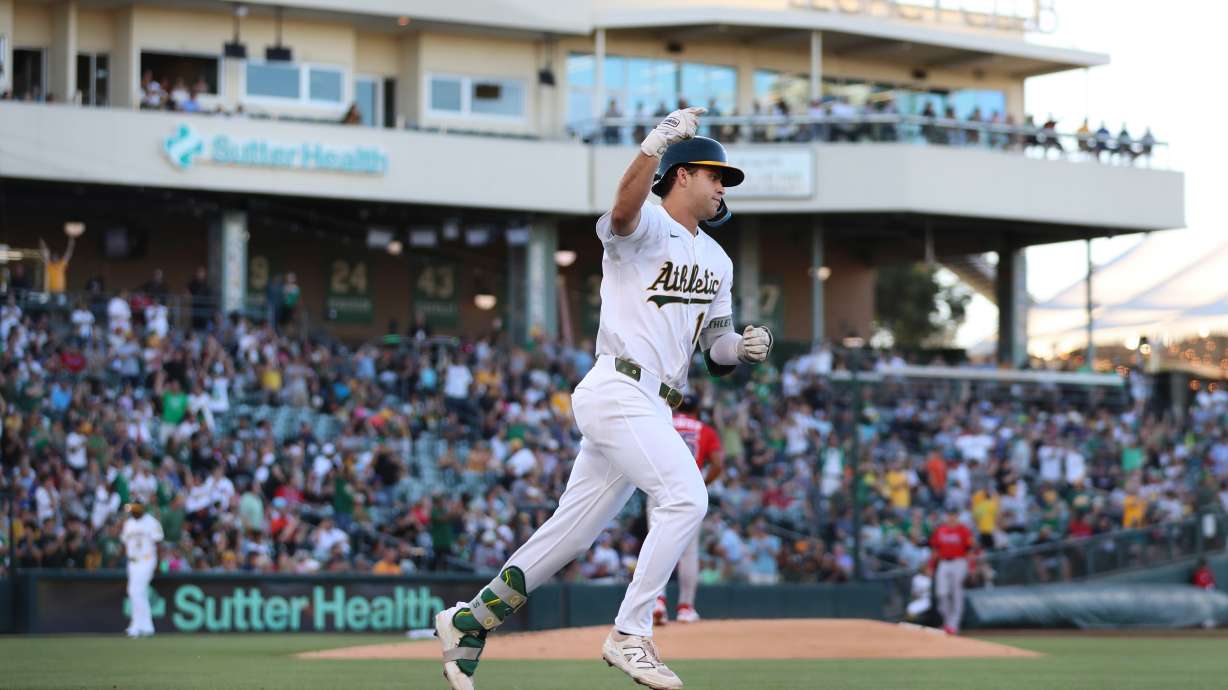 FILE - Athletics' Max Muncy celebrates a two-run home run during the first inning of a baseball game against the Atlanta Braves, Tuesday, July 8, 2025, in West Sacramento, Calif.