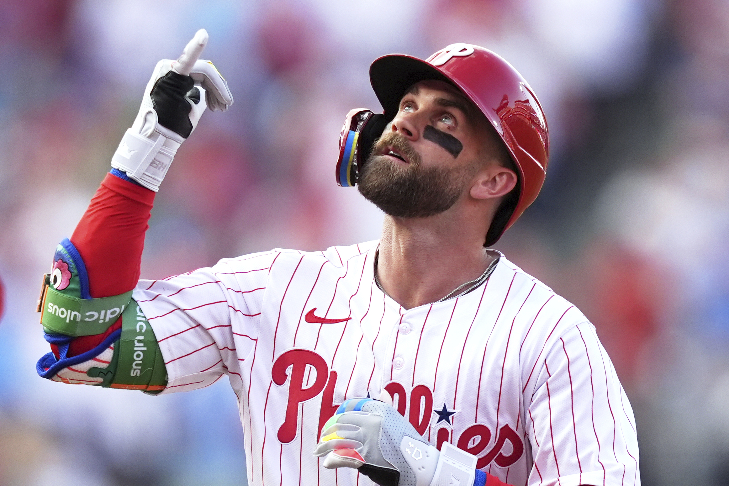 Philadelphia Phillies' Bryce Harper reacts after hitting a home run against Boston Red Sox pitcher Lucas Giolito during the first inning of a baseball game Wednesday, July 23, 2025, in Philadelphia. 