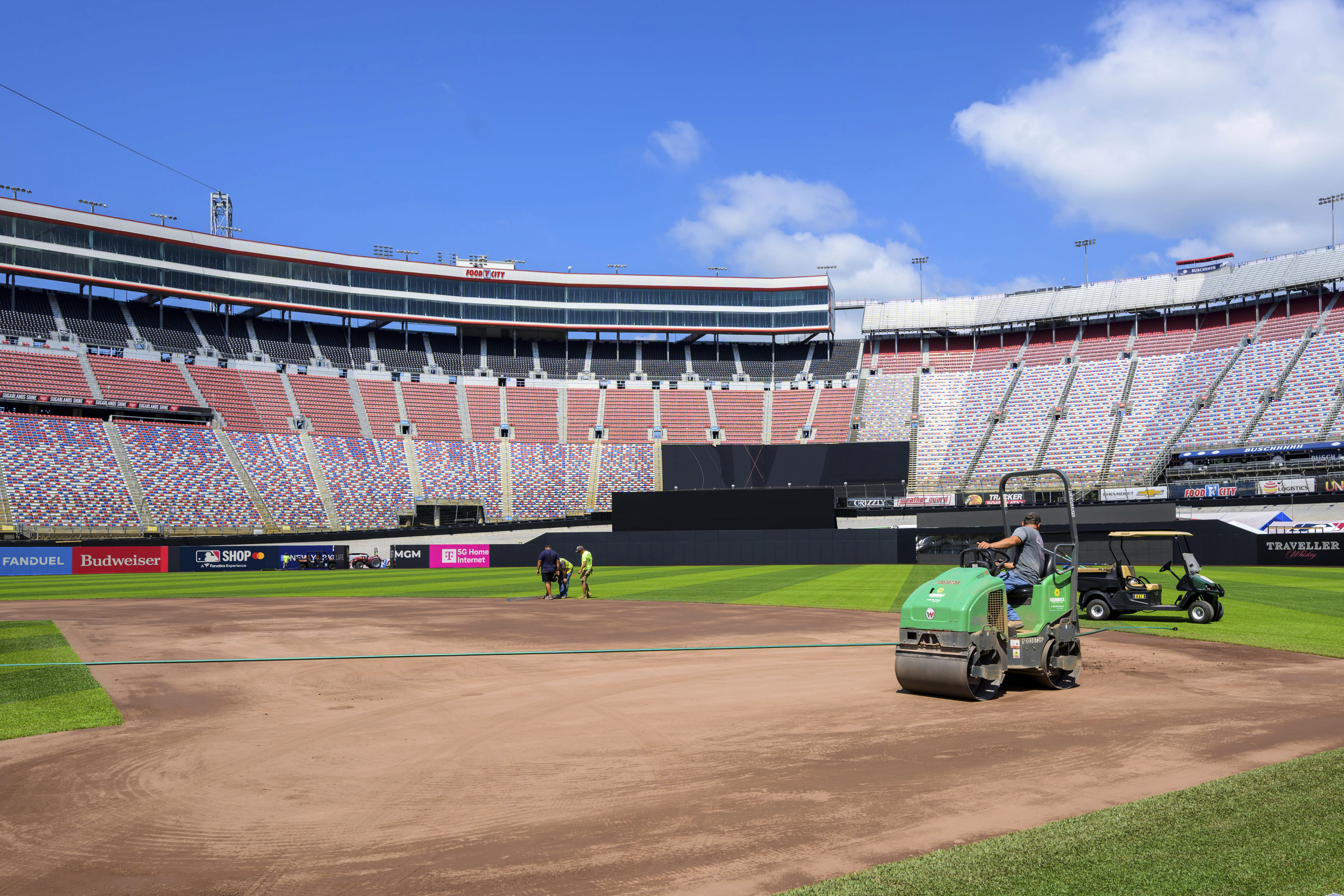 Work continues on the baseball field inside the racetrack at Bristol Motor Speedway, Friday, July 25, 2025, in Bristol, Tenn., for MLB Speedway Classic baseball game between the Cincinnati Reds and Atlanta Braves on Aug. 2. (Earl Neikirk/Bristol Motor Speedway via AP