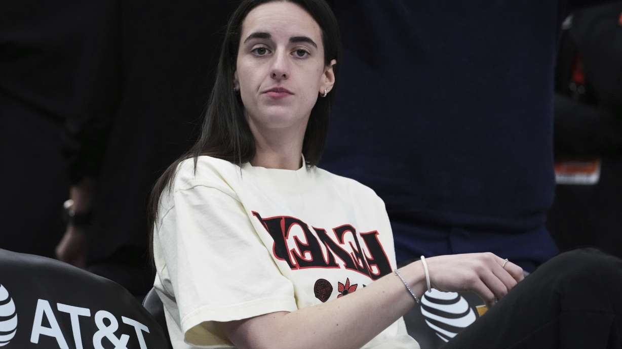Indiana Fever guard Caitlin Clark looks on before a WNBA basketball game against the Chicago Sky, Sunday, July 27, 2025, in Chicago.