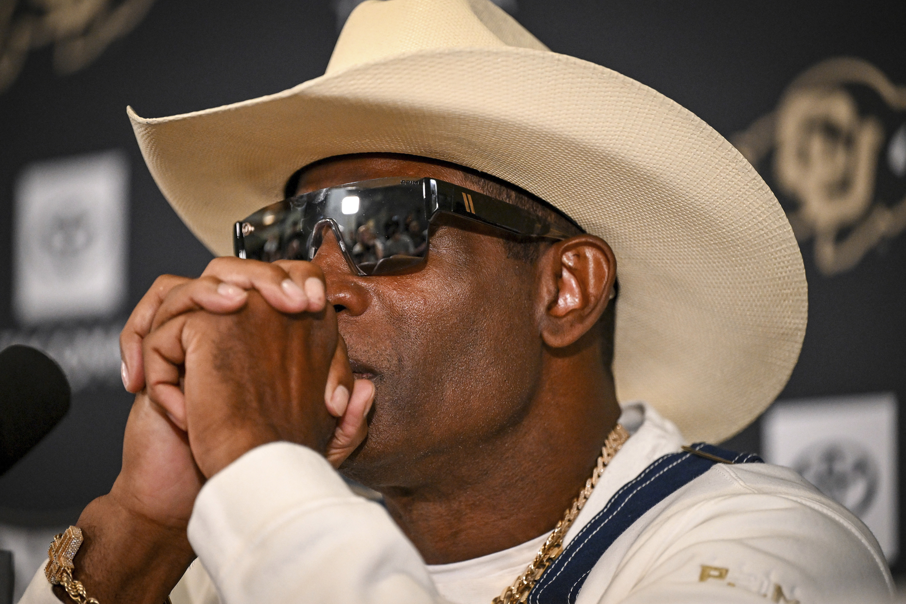 Colorado head coach Deion Sanders considers a question during a news conference to discuss his journey in beating bladder cancer Monday, July 28, 2025, in Boulder, Colo. /