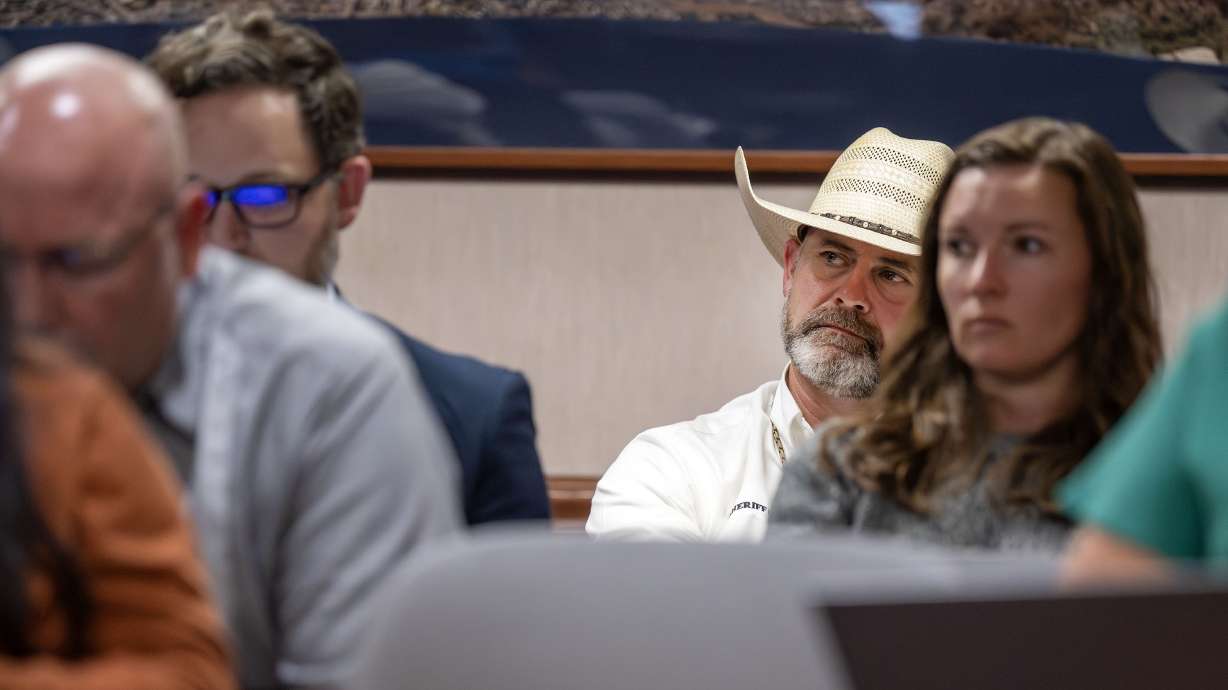 Utah County Sheriff Mike Smith listens to debate about entering into a cooperative agreement with U.S. immigration officials in Provo on July 16. Smith, immediate past president of the Utah Sheriffs Association, is a backer of such agreements.