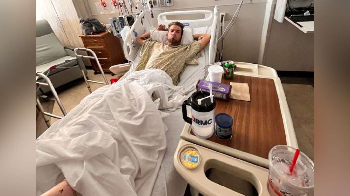 Justin Cummins recovers in his hospital bed at Eastern Idaho Regional Medical Center in Idaho Falls. His leg was nearly severed after a serious Jet Ski crash on the Snake River near Ririe, Idaho, on July 17.