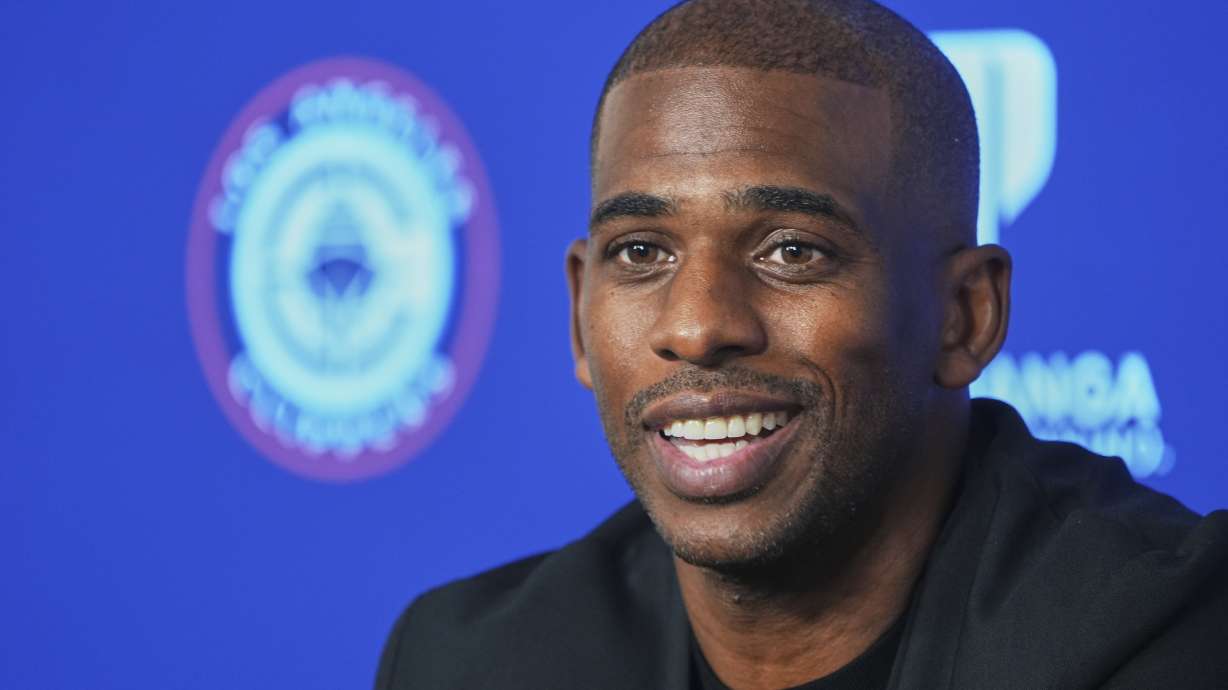 Chris Paul takes questions from the media as he is introduced as the newest member of the Los Angeles Clippers during an NBA basketball news conference in Inglewood, Calif., Monday, July 28, 2025.