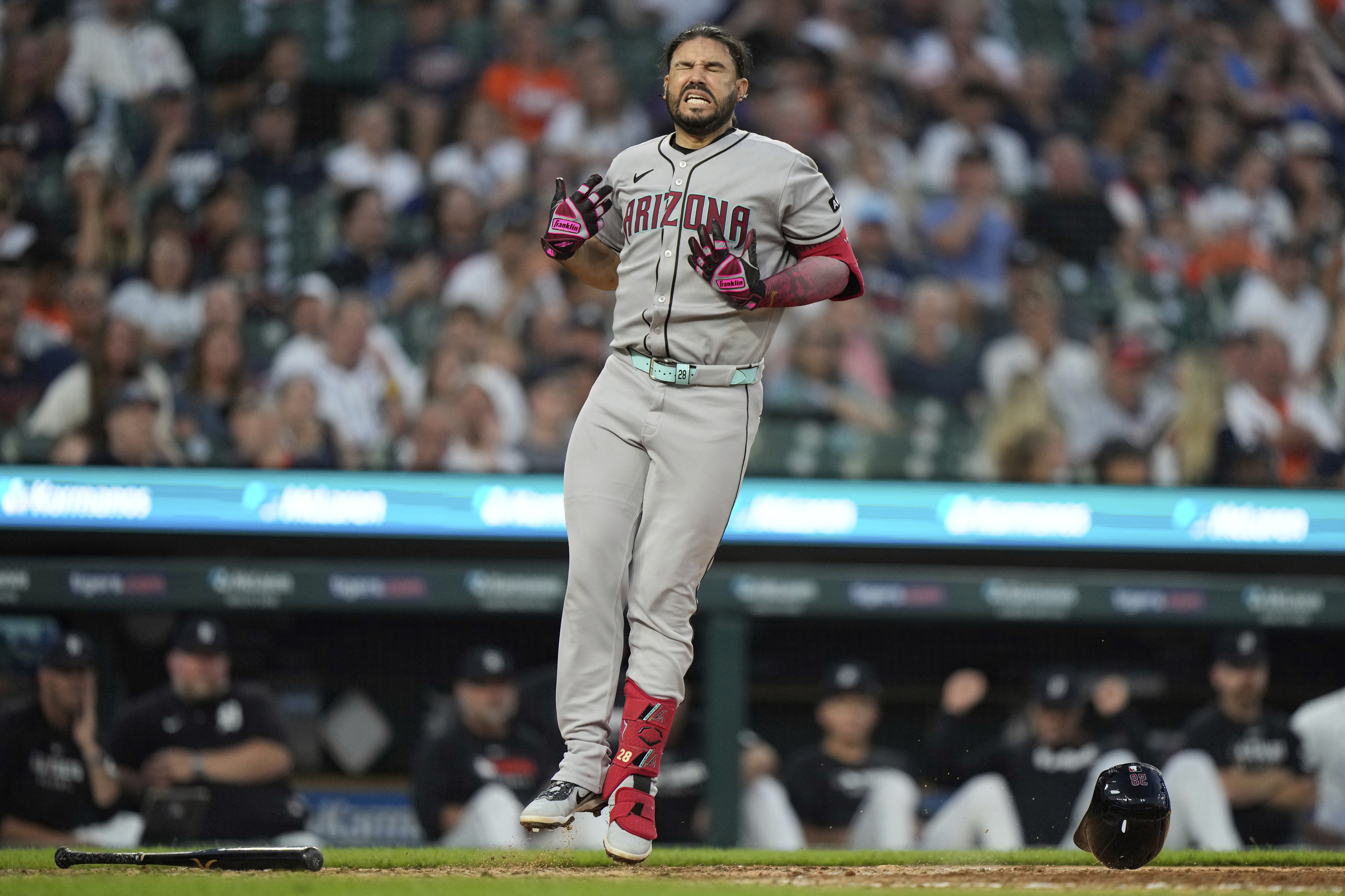 Arizona Diamondbacks' Eugenio Suarez reacts after being hit by a pitch during the ninth inning of a baseball game against the Detroit Tigers Monday, July 28, 2025, in Detroit. 