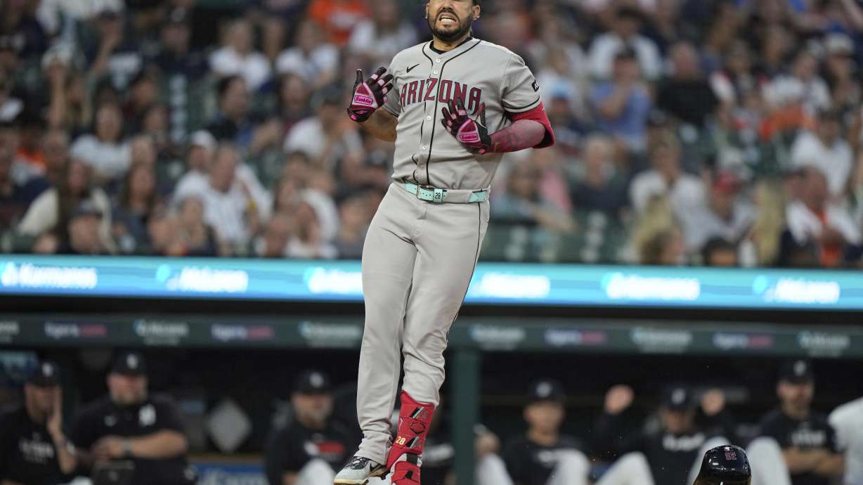 Arizona Diamondbacks' Eugenio Suarez reacts after being hit by a pitch during the ninth inning of a baseball game against the Detroit Tigers Monday, July 28, 2025, in Detroit.