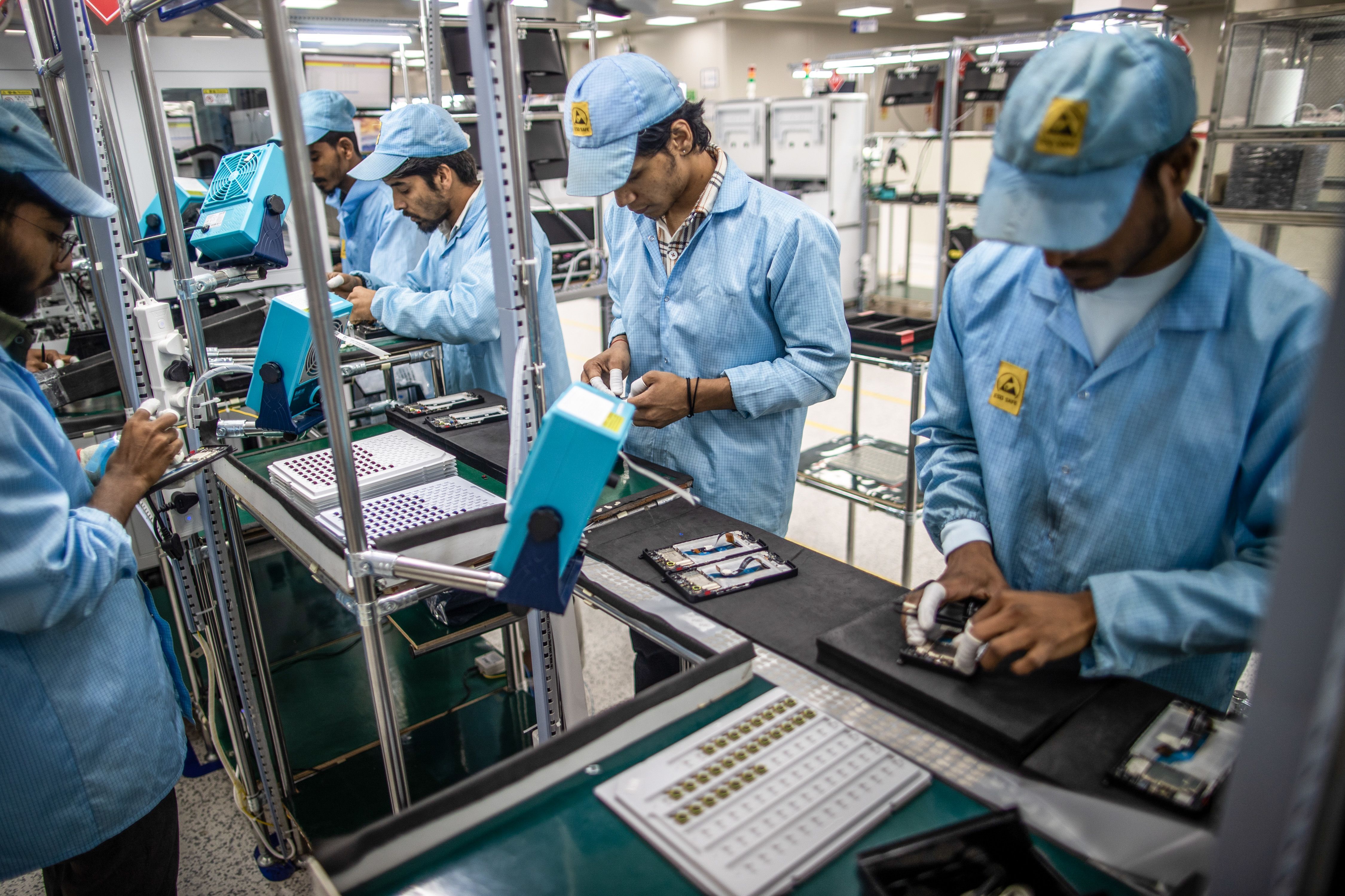 Employees work on a cellphone assembly line at Padget Electronics Pvt., a subsidiary of Dixon Technologies, in Noida, India, in March 2024. A new report shows India is now the biggest smartphone exporter to the U.S.