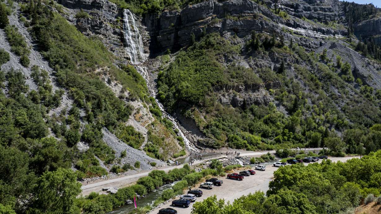 Visitors recreate at the base of Bridal Veil Falls in Provo Canyon, July 19. Utah County is seeking to obtain federal land at the base of Bridal Veil Falls.
