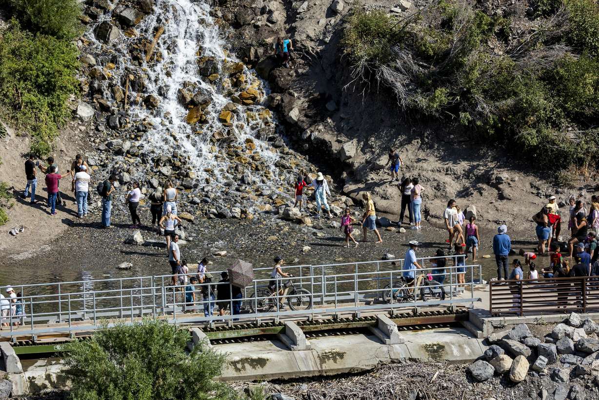Visitors recreate at the base of the falls at Bridal Veil Falls in Provo Canyon on Saturday, July 19.