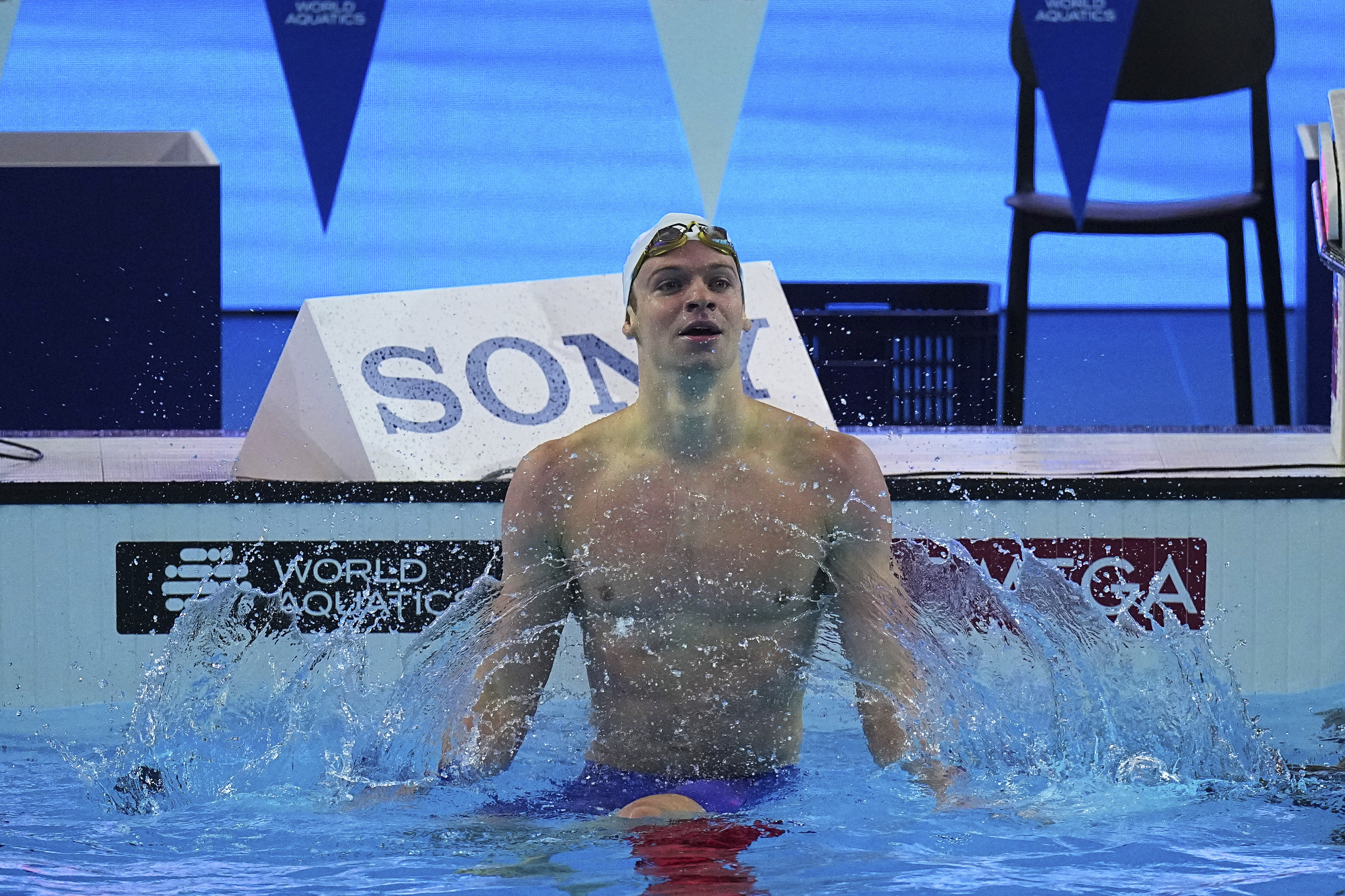 Leon Marchand of France celebrates after competing in the men's 200-meter individual medley semifinals at the World Aquatics Championships in Singapore, Wednesday, July 30, 2025. 